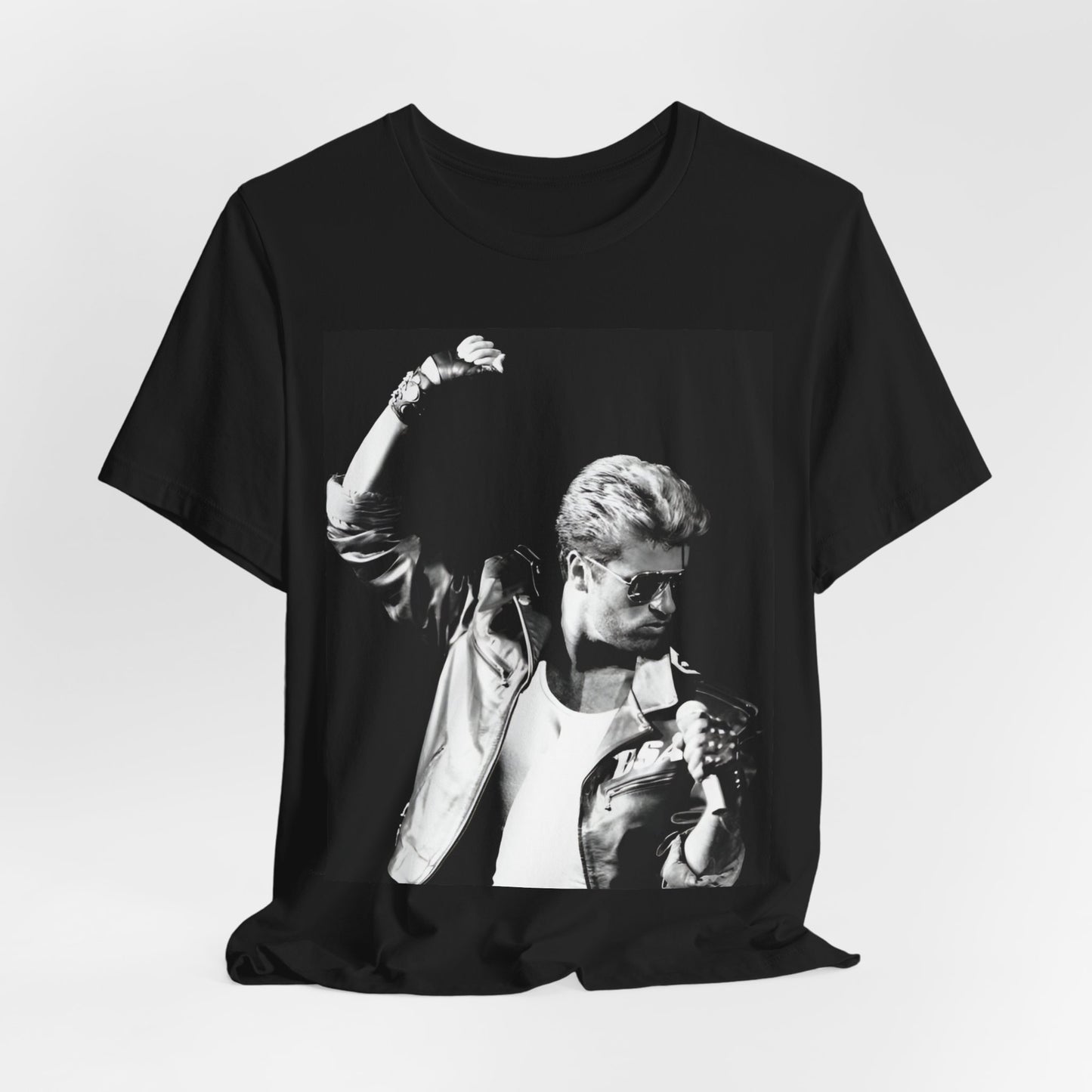 A black graphic t-shirt featuring a black and white photo of George Michael from his 'Faith' album era.