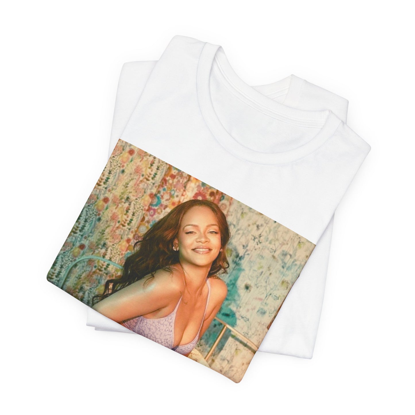 A black graphic t-shirt featuring a graphic of Rihanna with a beauty aesthetic.