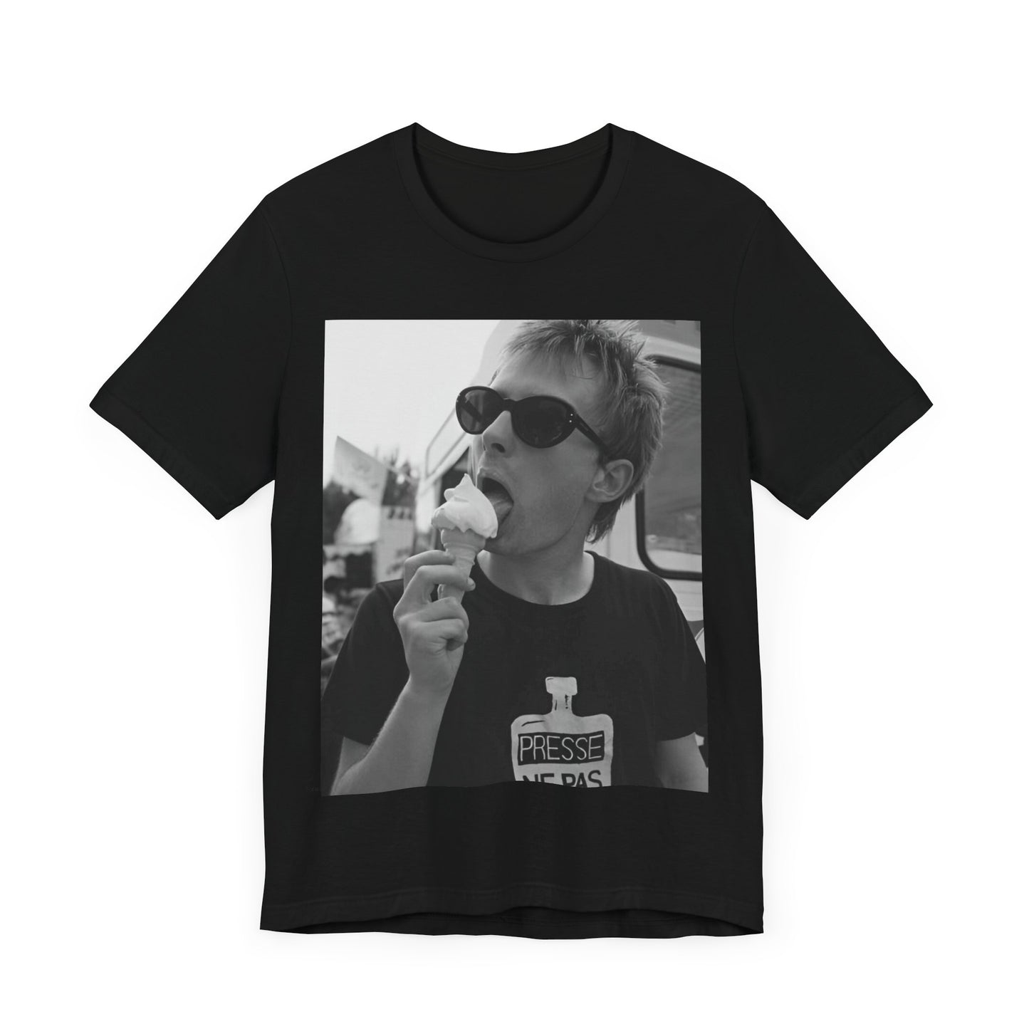 A black graphic t-shirt featuring a graphic of Thom Yorke from Radiohead with an ice cream cone.