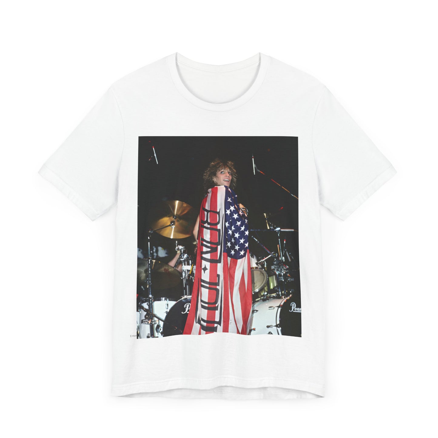 A black graphic t-shirt featuring a graphic of Bon Jovi performing on stage with an American flag as a backdrop.