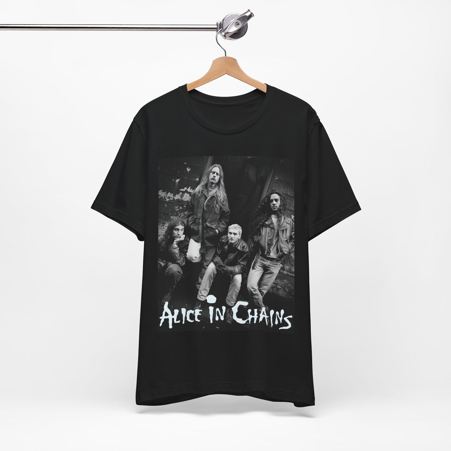 A black graphic t-shirt featuring a 90s black and white photographic portrait of the band Alice In Chains, capturing their iconic grunge look.