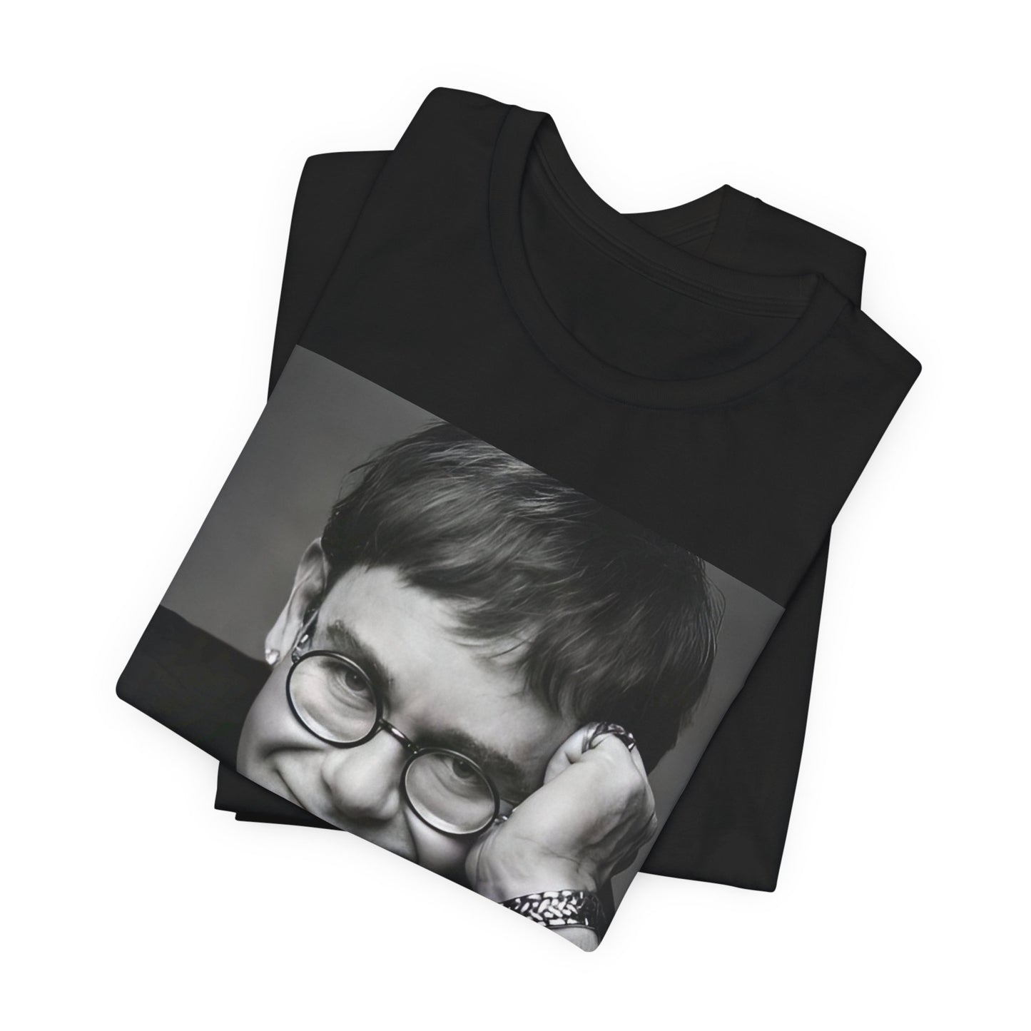 A black graphic t-shirt featuring a retro black and white photo portrait of Elton John.