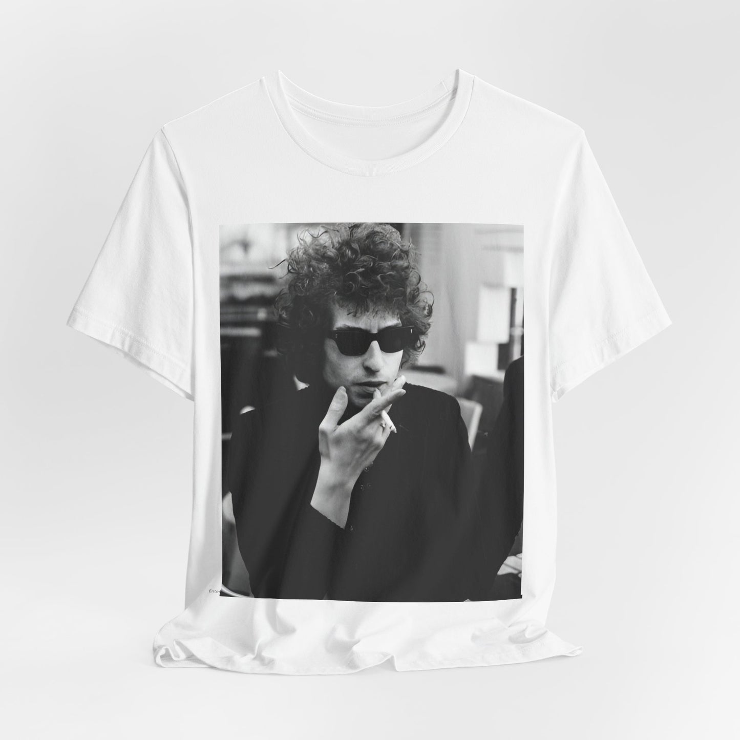 A black graphic t-shirt featuring a retro black and white graphic of Bob Dylan in a rebellious pose.