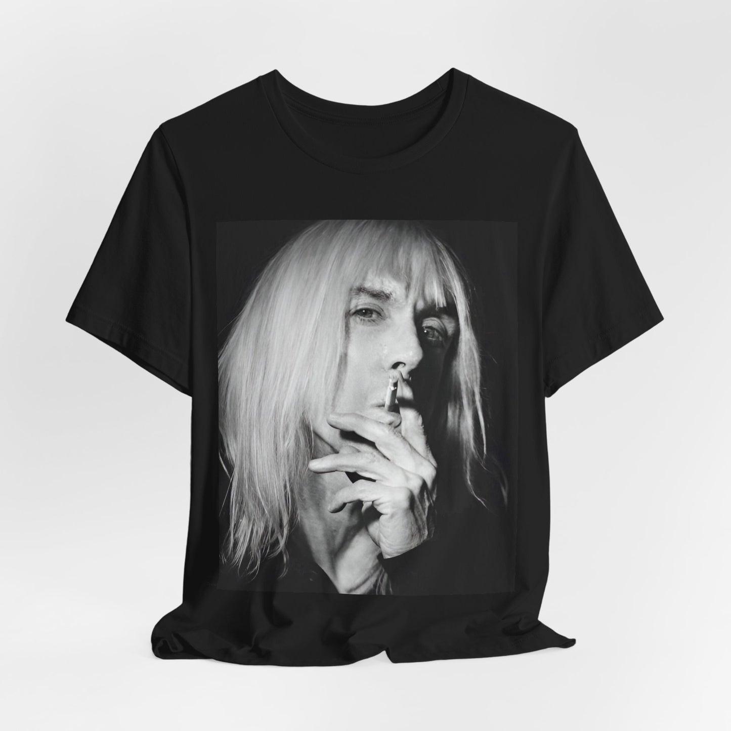 A black graphic t-shirt featuring a black and white graphic or photo of Iggy Pop holding a cigar.