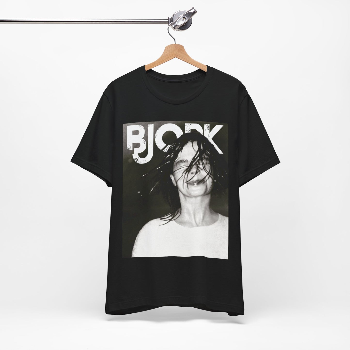A black graphic t-shirt featuring a dark, artistic graphic of Bjork, possibly with a mysterious or otherworldly feel.