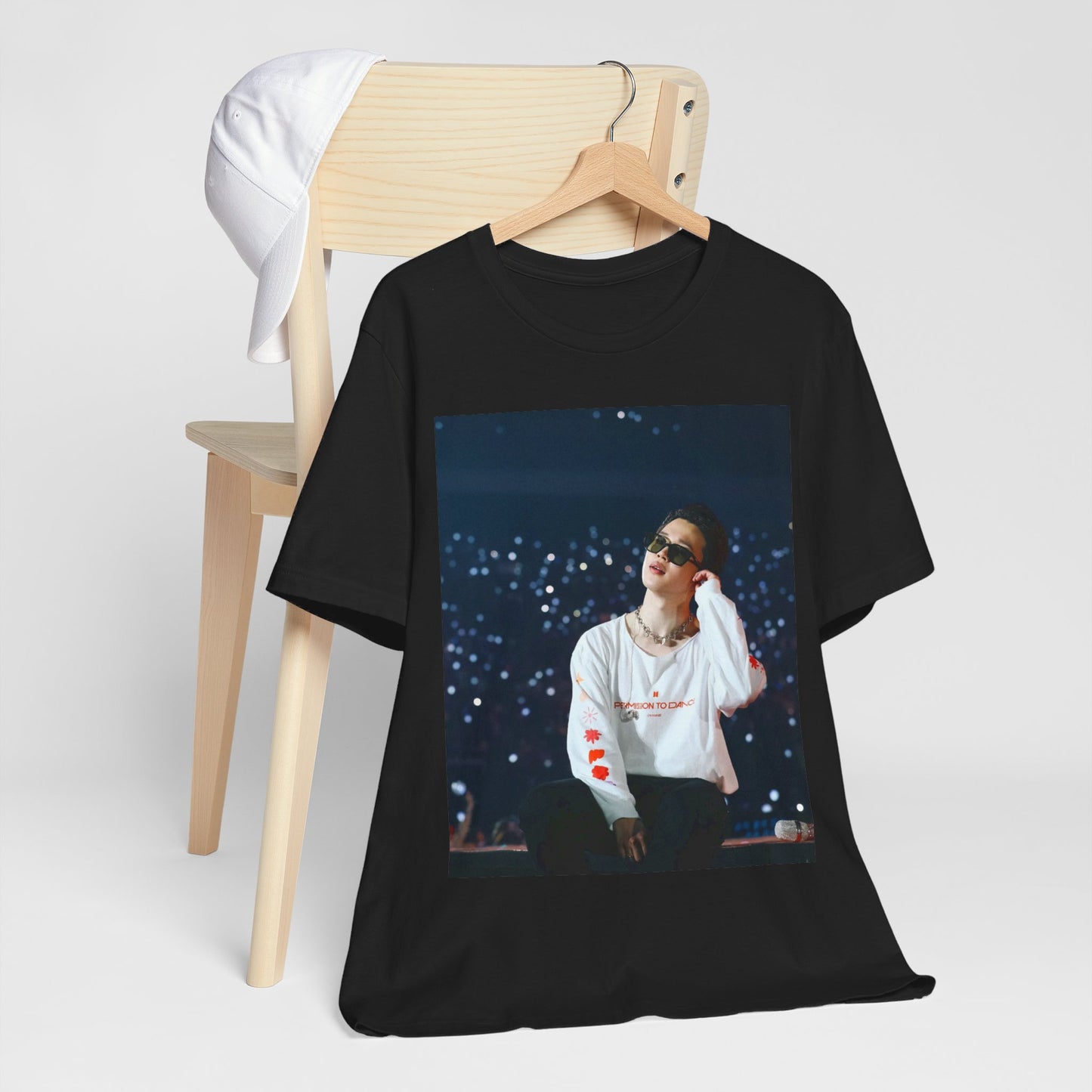 A black graphic t-shirt featuring a vintage aesthetic graphic related to Jimin's 'Lie' era.