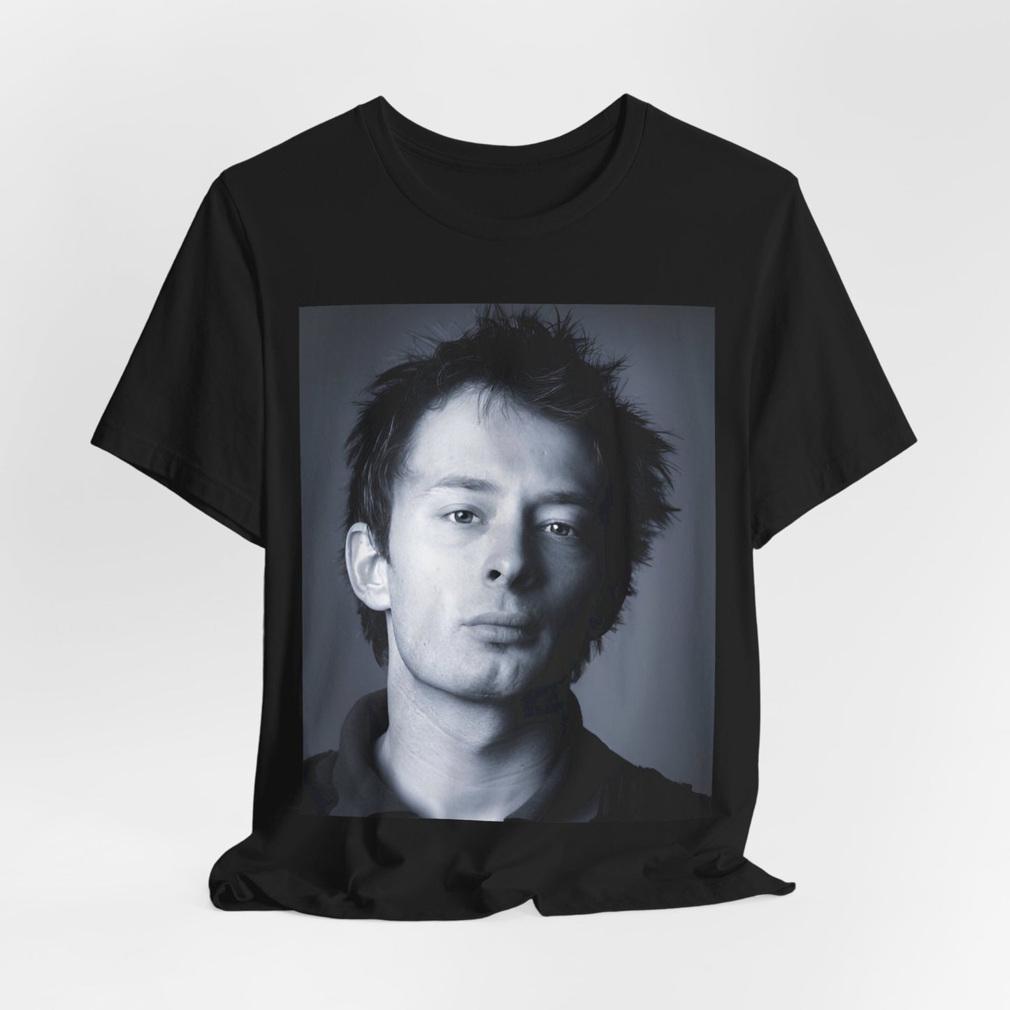 A black graphic t-shirt featuring an enigmatic graphic of Thom Yorke from Radiohead as a frontman.