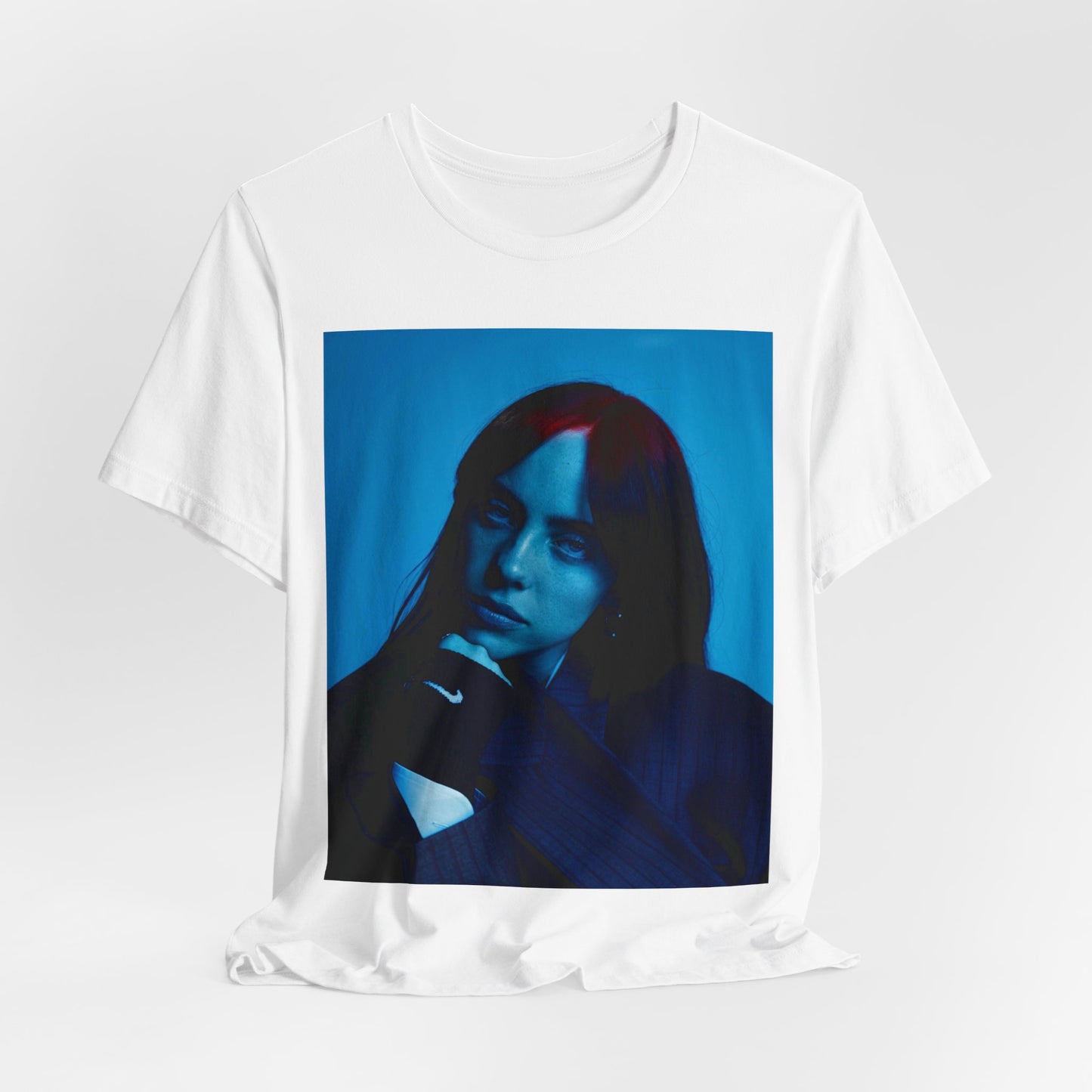 A soft, slightly blurred photo of Billie Eilish, evoking the dreamy and nostalgic feel of her song 'Ocean Eyes,' printed on a t-shirt.