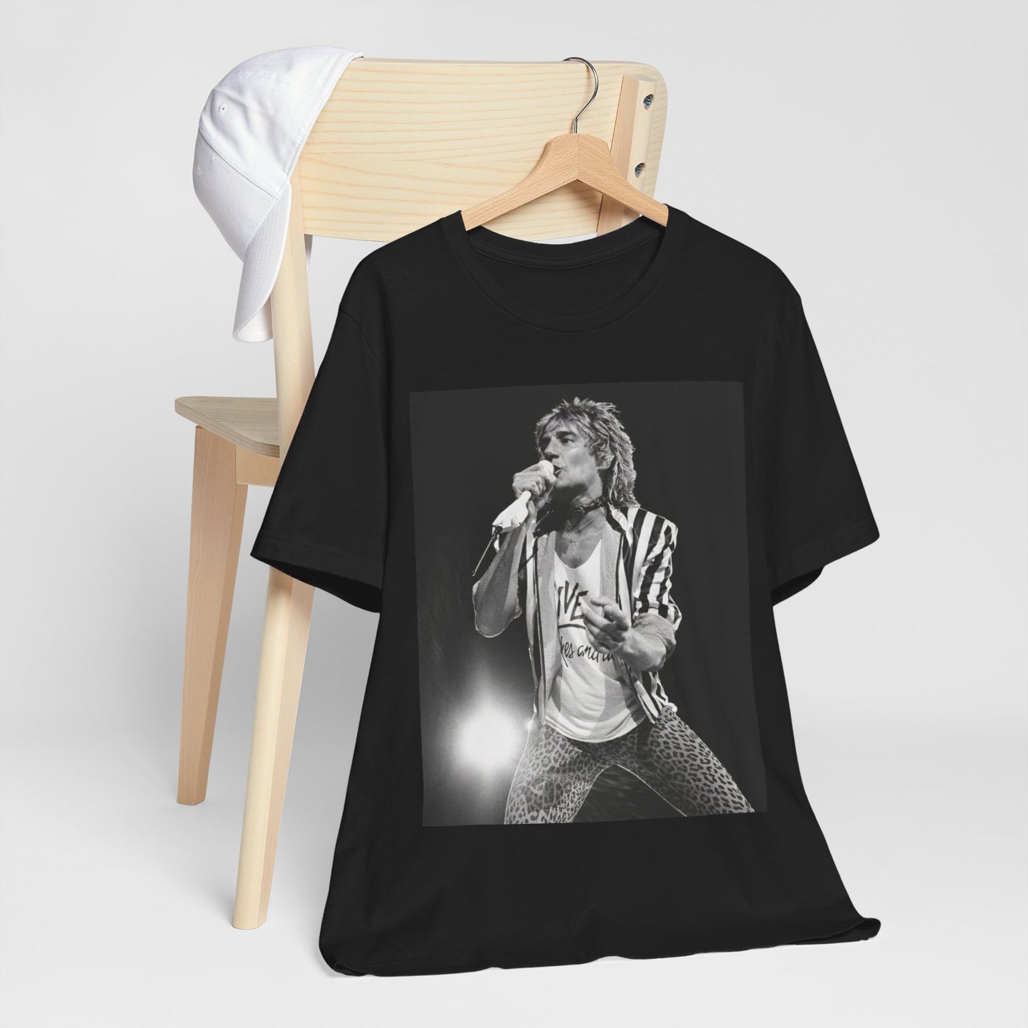 A black graphic t-shirt featuring a black and white portrait photo of Rod Stewart.
