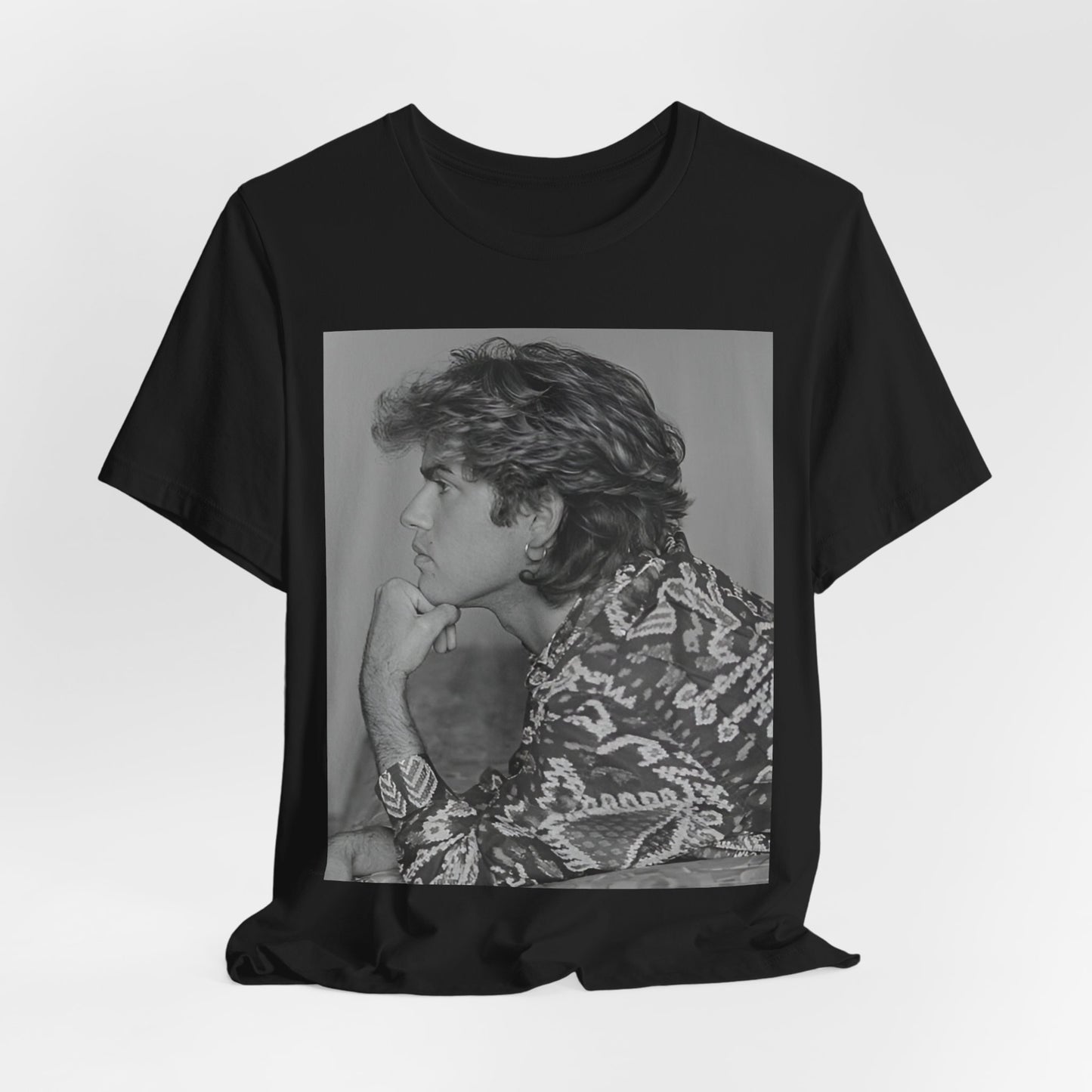 A black graphic t-shirt featuring a graphic of George Michael from his 80s Wham! era.