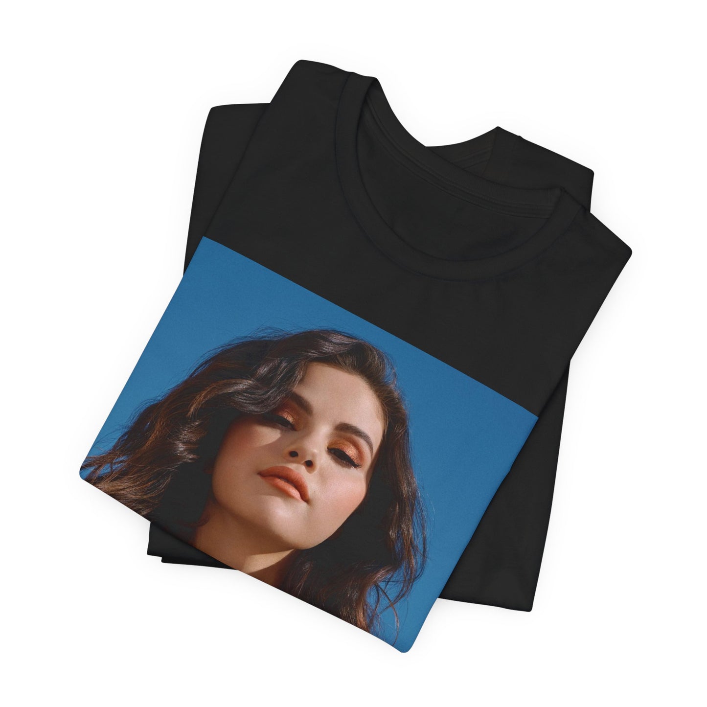 A black graphic t-shirt featuring a vintage pop icon graphic of Selena Gomez.
