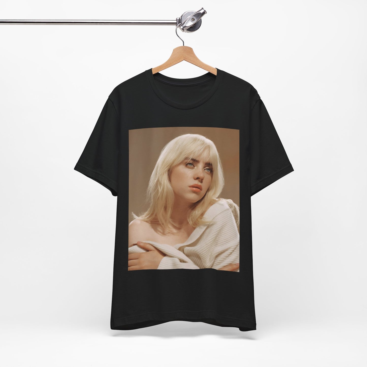 The iconic visual of Billie Eilish with black tears streaming down her face from the 'when the party's over' music video, printed on a t-shirt.