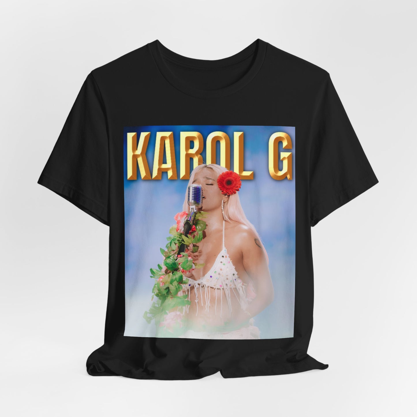 A black graphic t-shirt featuring a graphic of Karol G as a classic Latin pop queen.