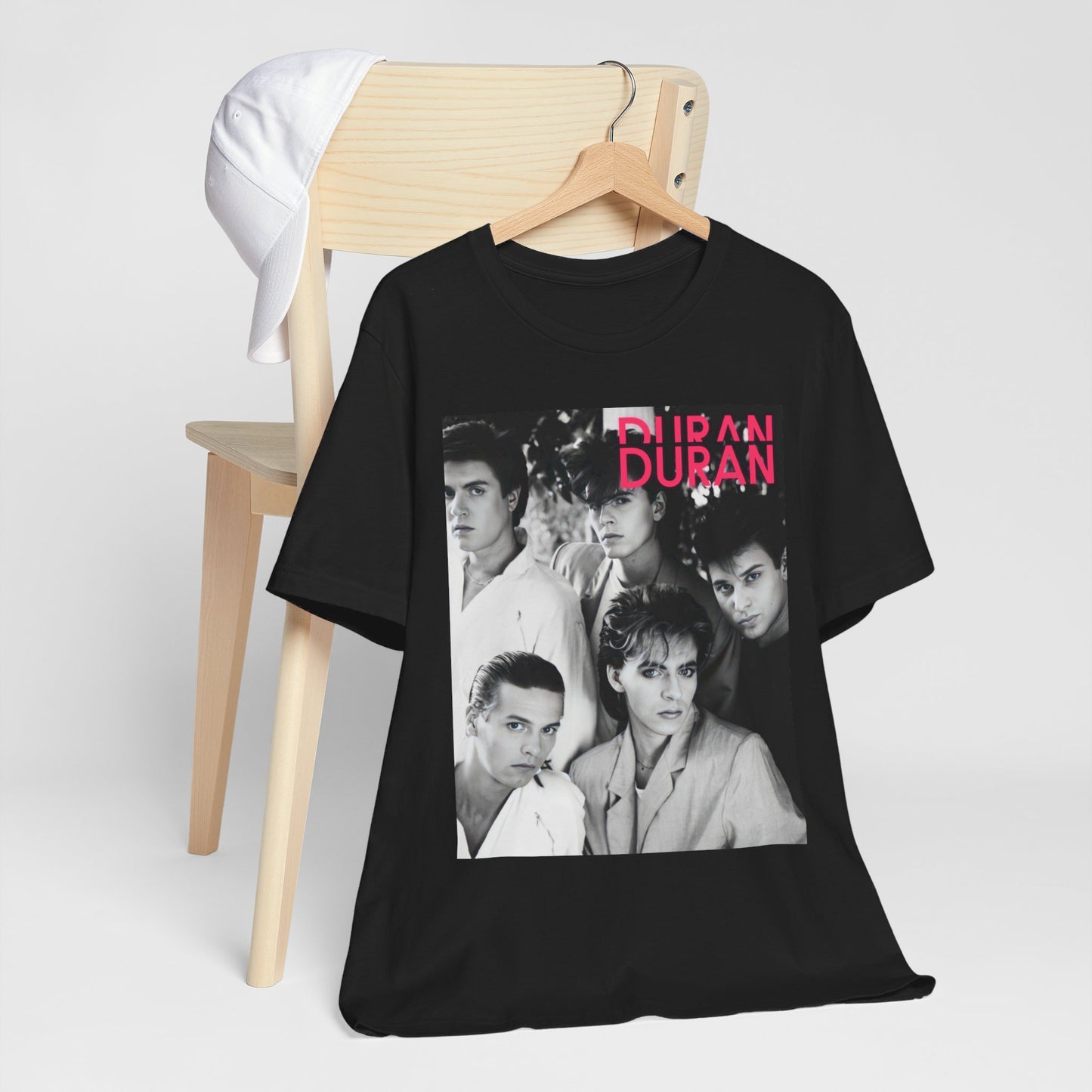 A black graphic t-shirt featuring an 80s black and white monochrome photo of the band Duran Duran.