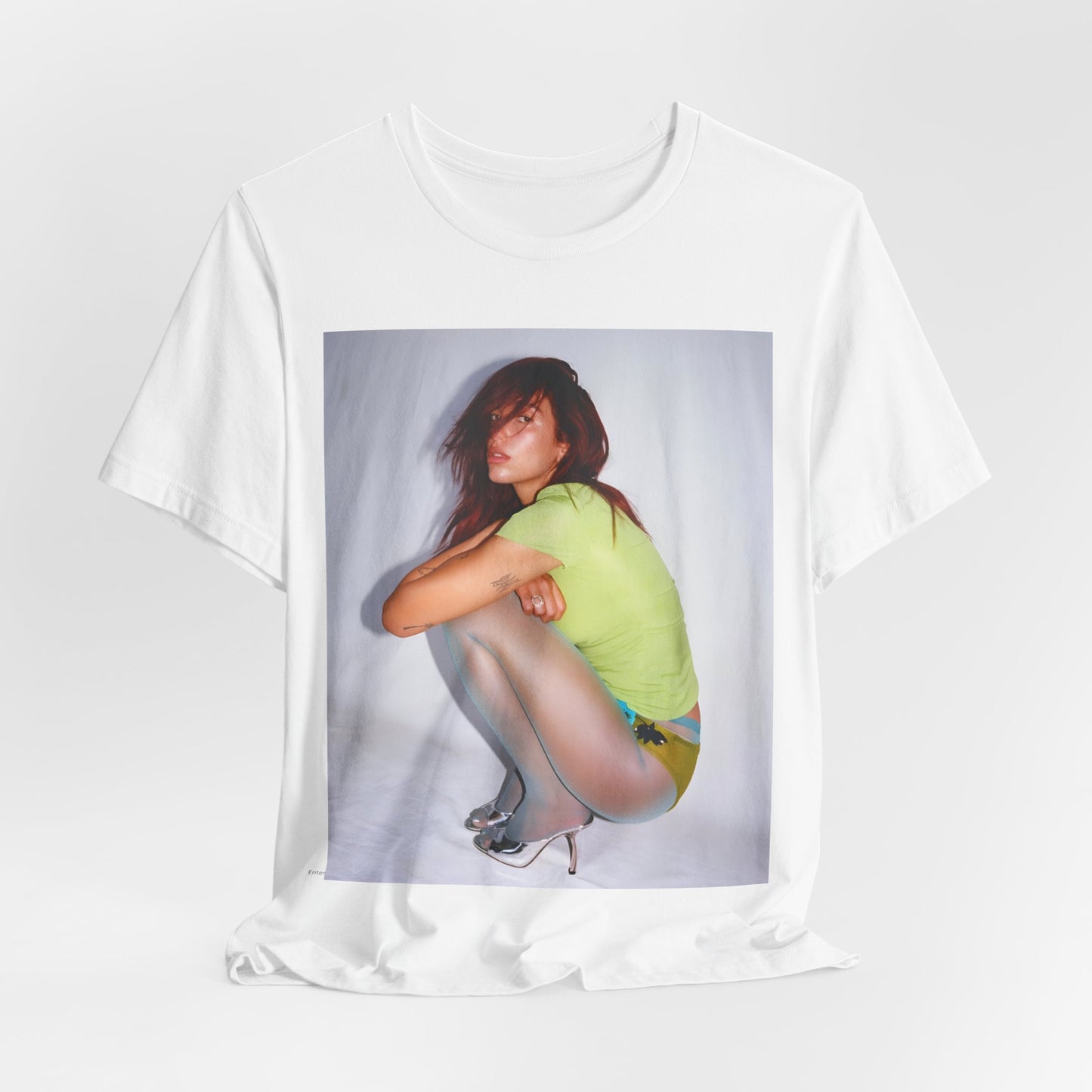 A black graphic t-shirt featuring a graphic inspired by Dua Lipa's 'Houdini' song.