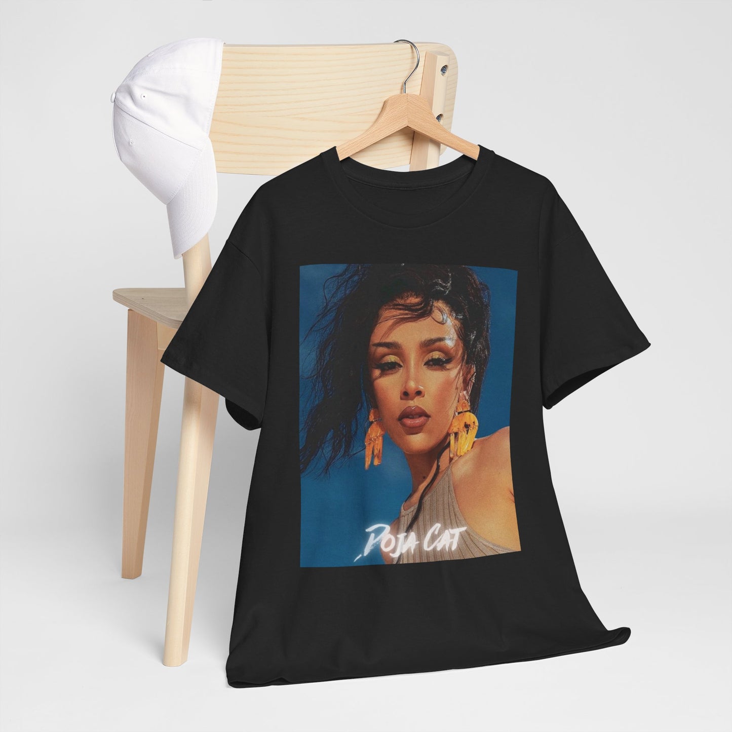 A black graphic t-shirt featuring a graphic of Doja Cat, evoking her 'Streets' era aesthetic.