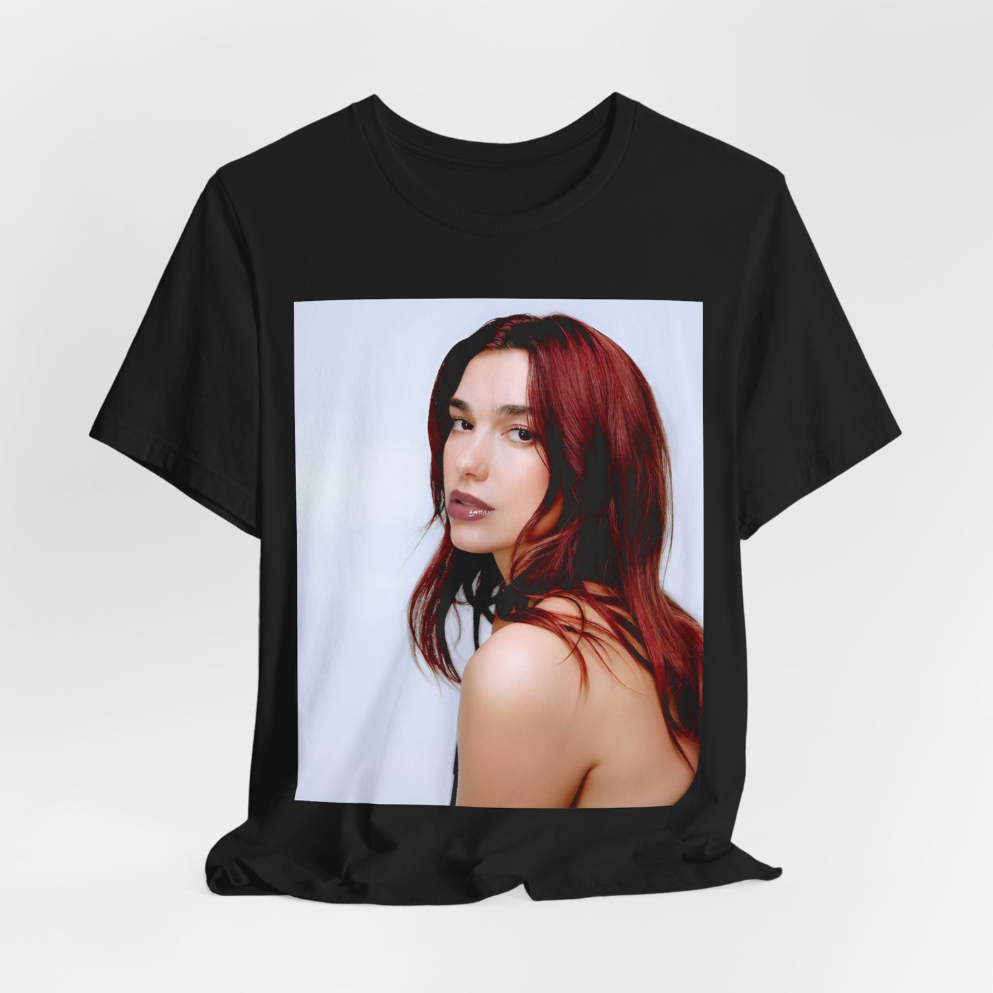 A black graphic t-shirt featuring a retro graphic inspired by Dua Lipa's "Don't Start Now" song.