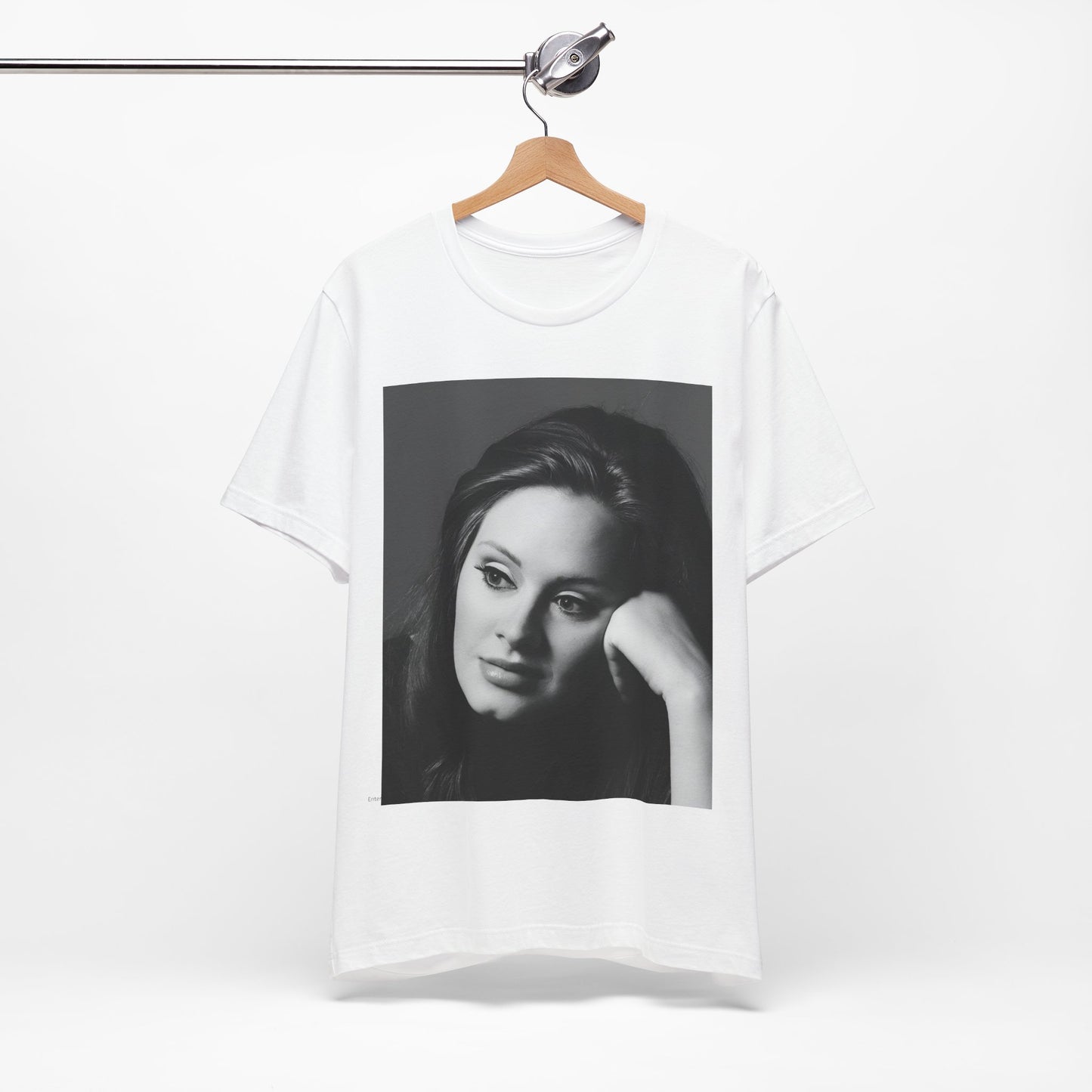 A black graphic t-shirt featuring a vintage-style black and white studio portrait of Adele, showing her with a poised and elegant expression.