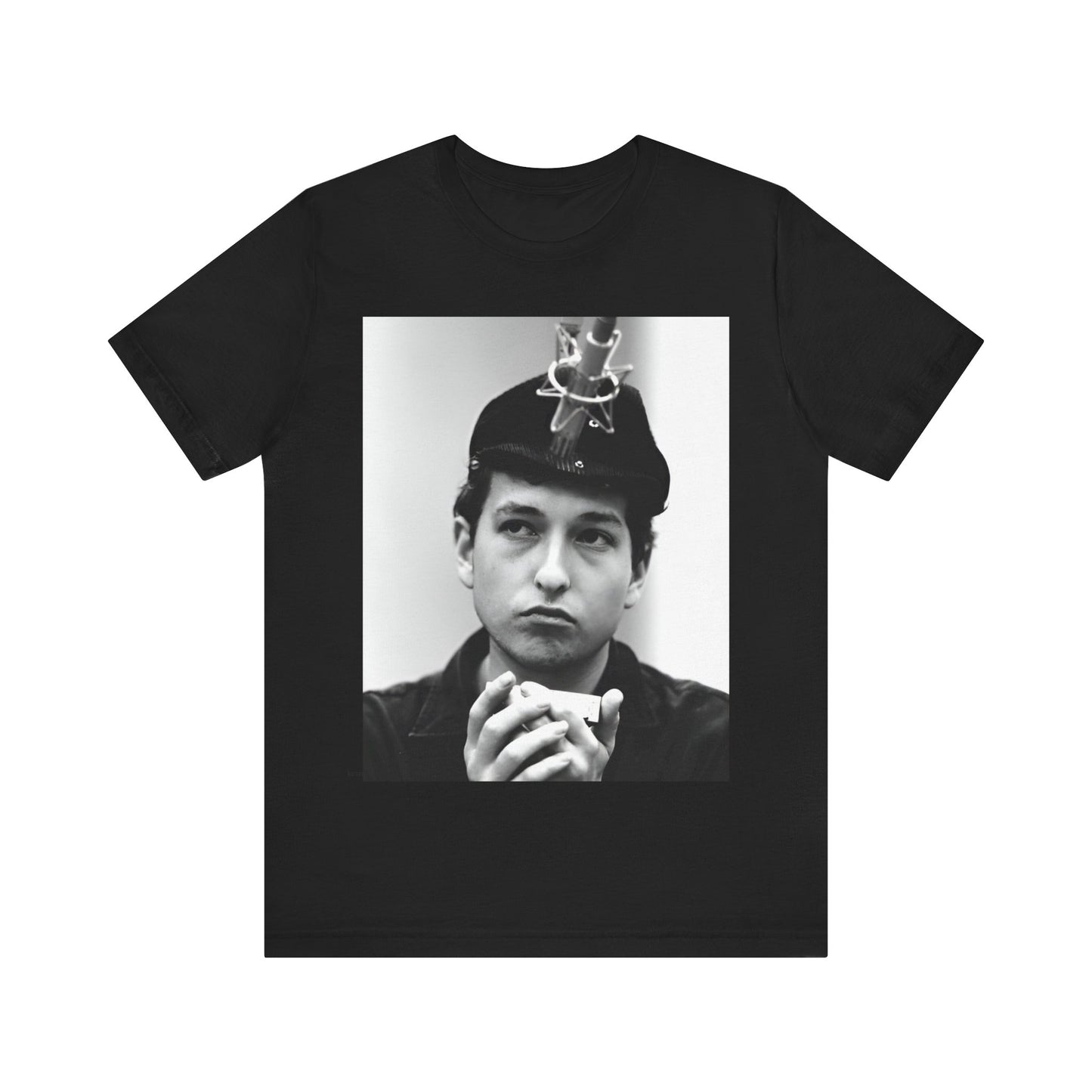 A black graphic t-shirt featuring a graphic of Bob Dylan in an acoustic session setting, possibly with his guitar.