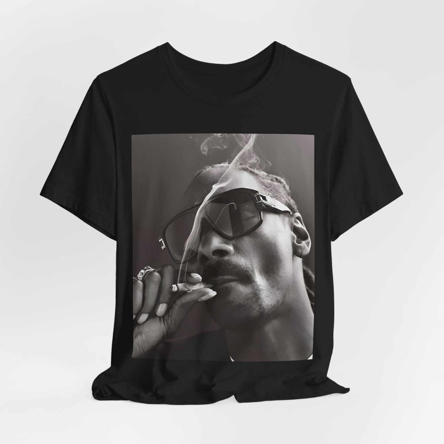 A black graphic t-shirt featuring an iconic black and white shaded portrait graphic of Snoop Dogg.