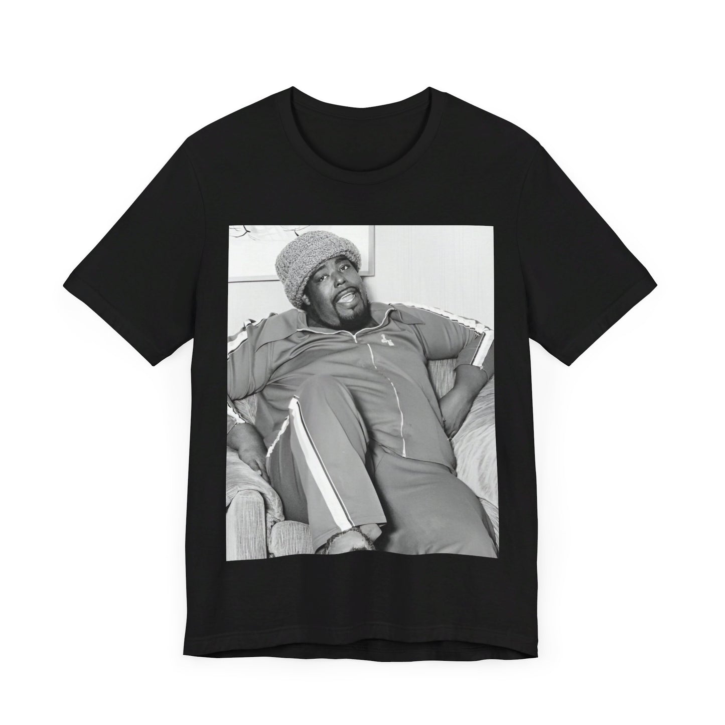 A black graphic t-shirt featuring a 70s-style portrait photo of Barry White in a lounge setting.