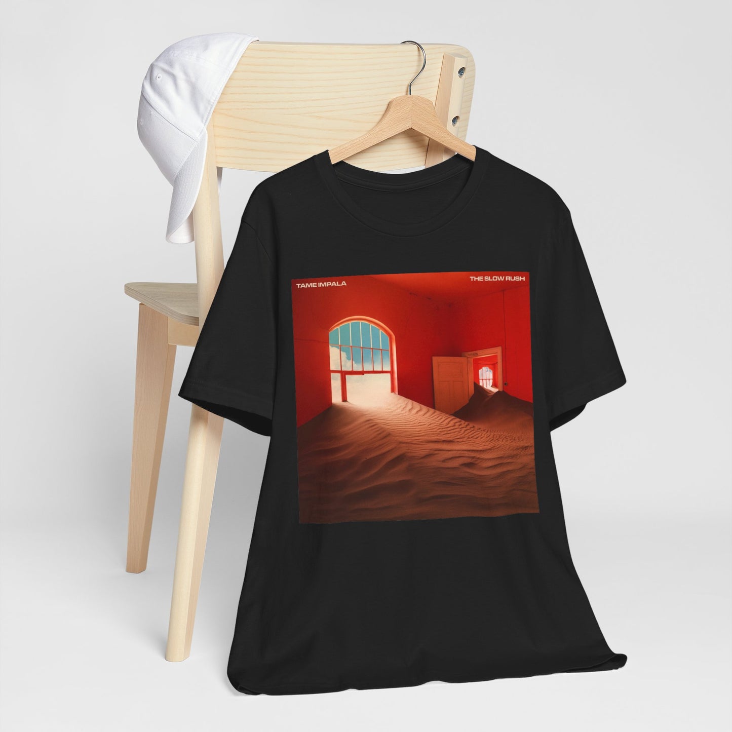 A black graphic t-shirt featuring a graphic related to Tame Impala's 'The Slow Rush' album.