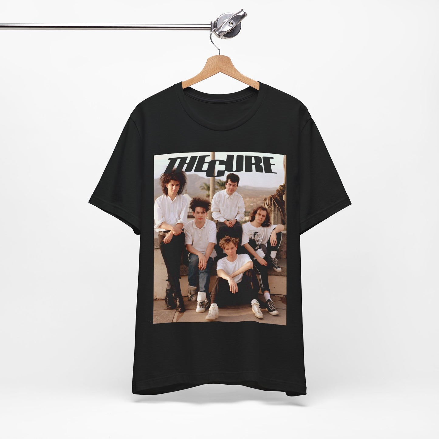 A black graphic t-shirt featuring a vintage graphic of The Cure with a dark romanticism theme.
