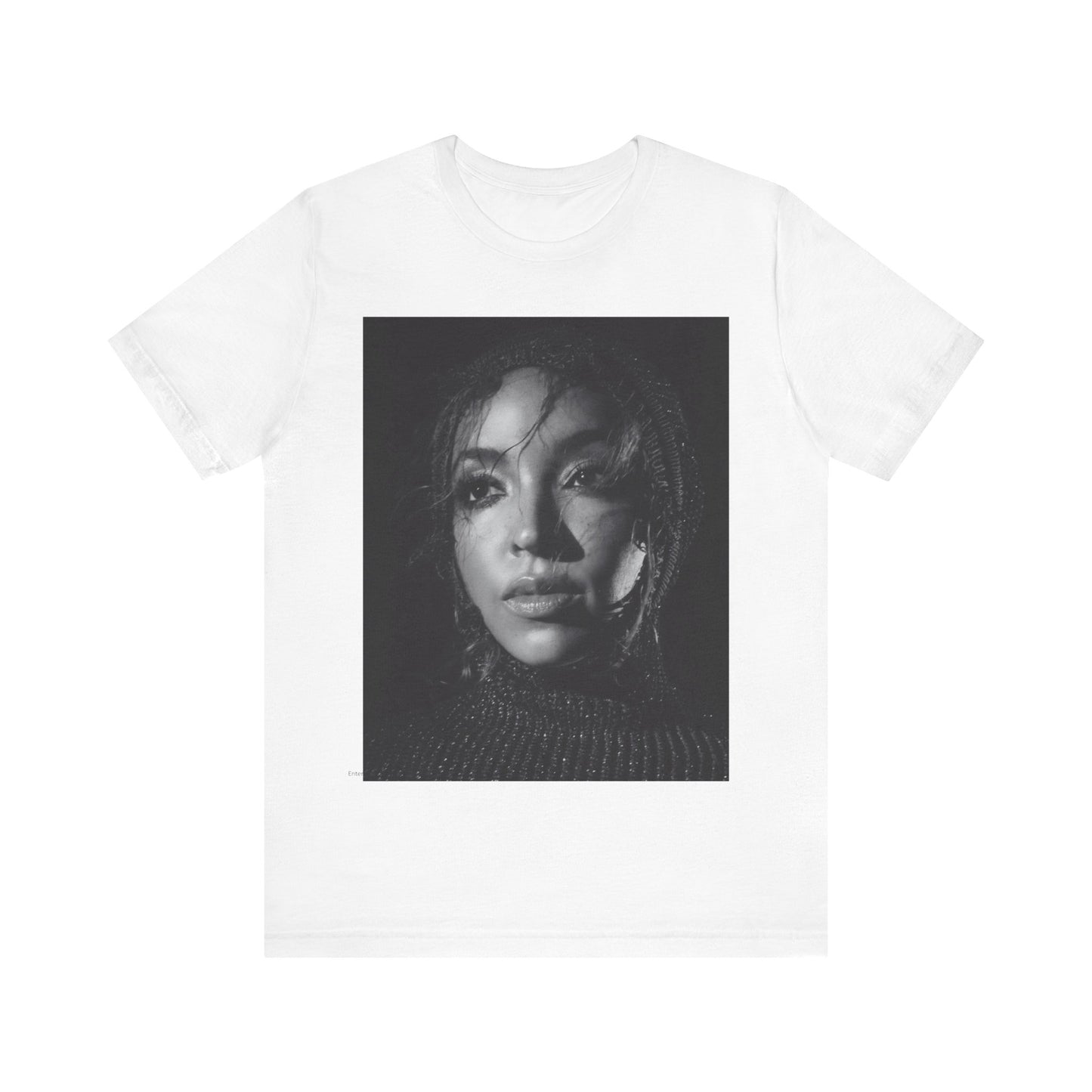 A black graphic t-shirt featuring a black and white portrait photo of Tinashe.