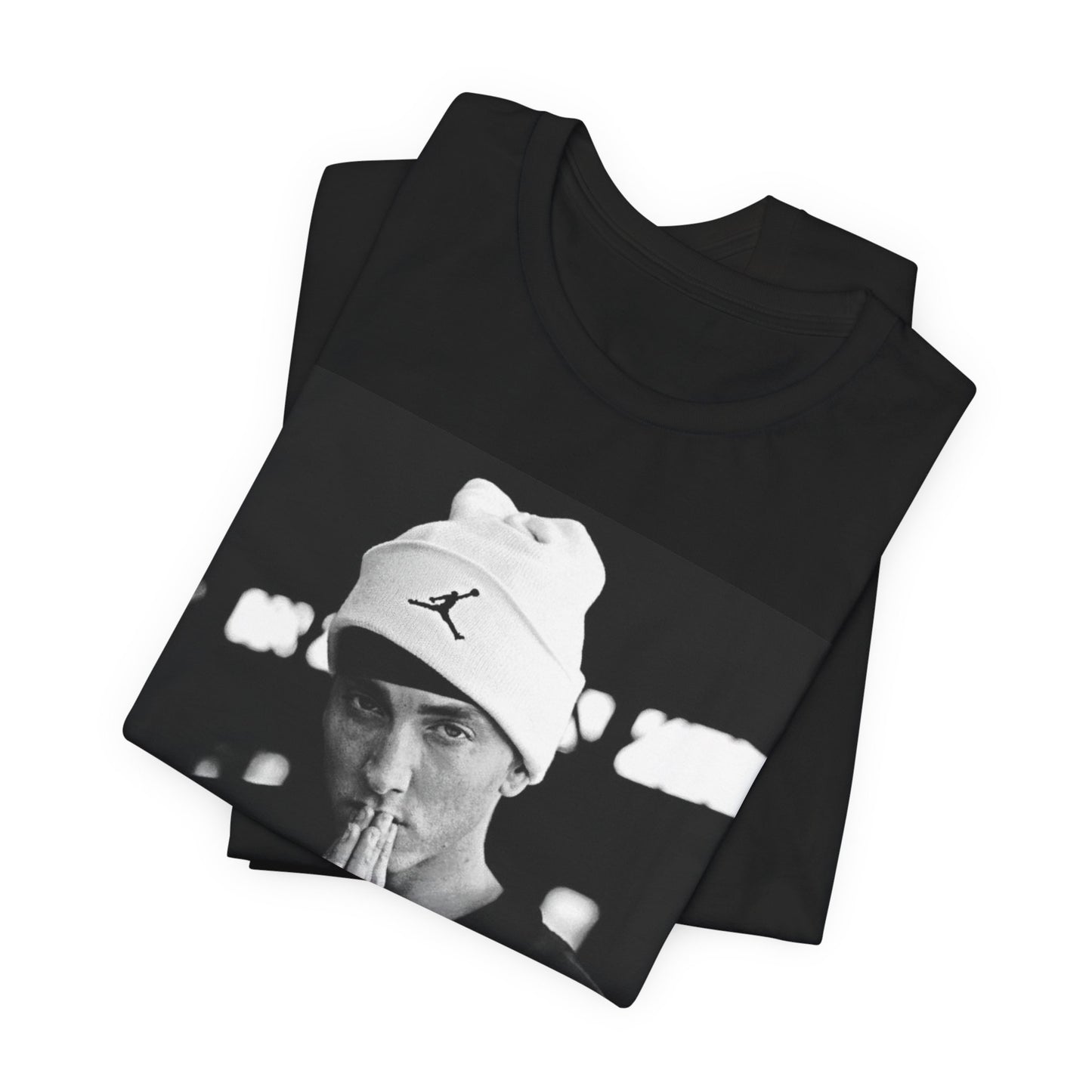 A black graphic t-shirt featuring a black and white portrait photo of Eminem.