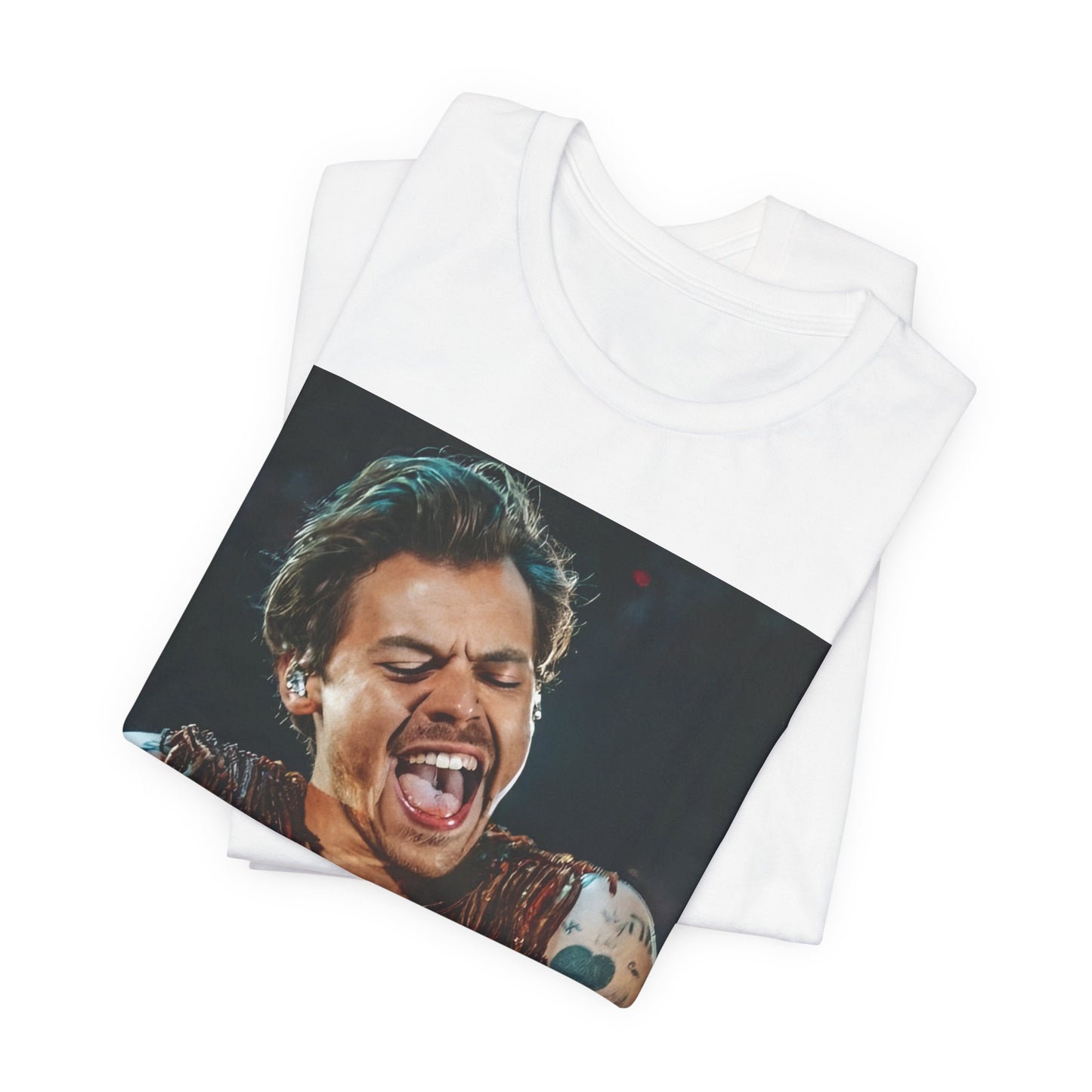 A black graphic t-shirt featuring a graphic or photo of Harry Styles performing live on stage.
