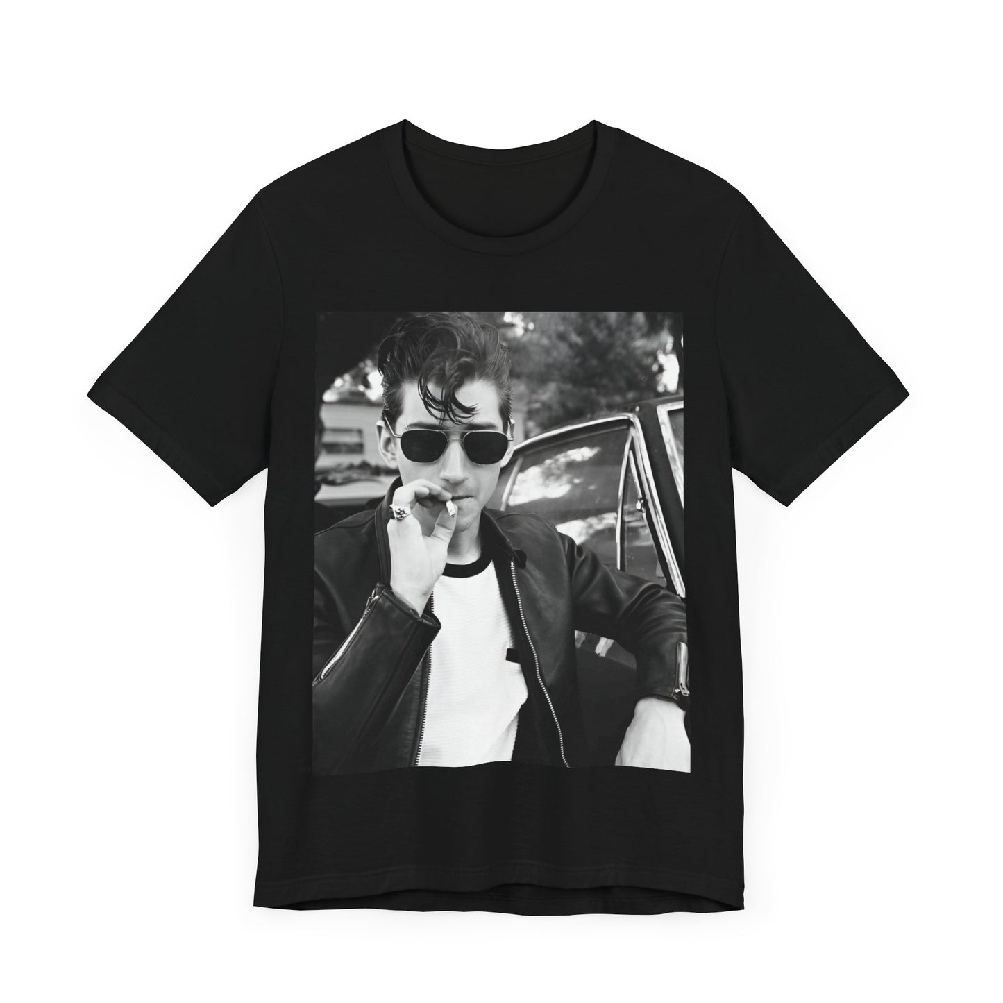 A black graphic t-shirt featuring a classic rock-style graphic of the Arctic Monkeys, possibly with band members in a stylized design.