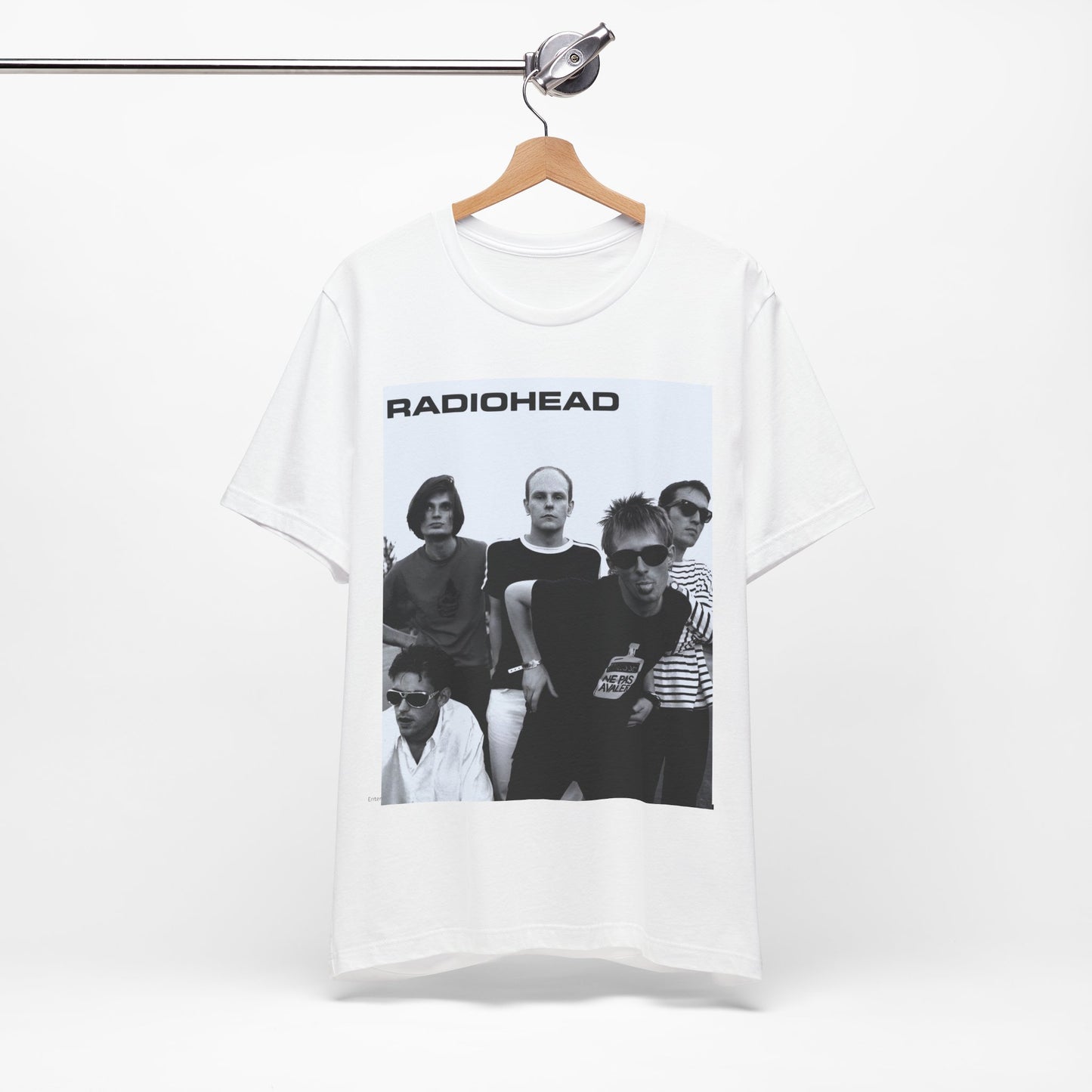 A black graphic t-shirt featuring a vintage 90s graphic related to Radiohead's 'Creep' song or era.