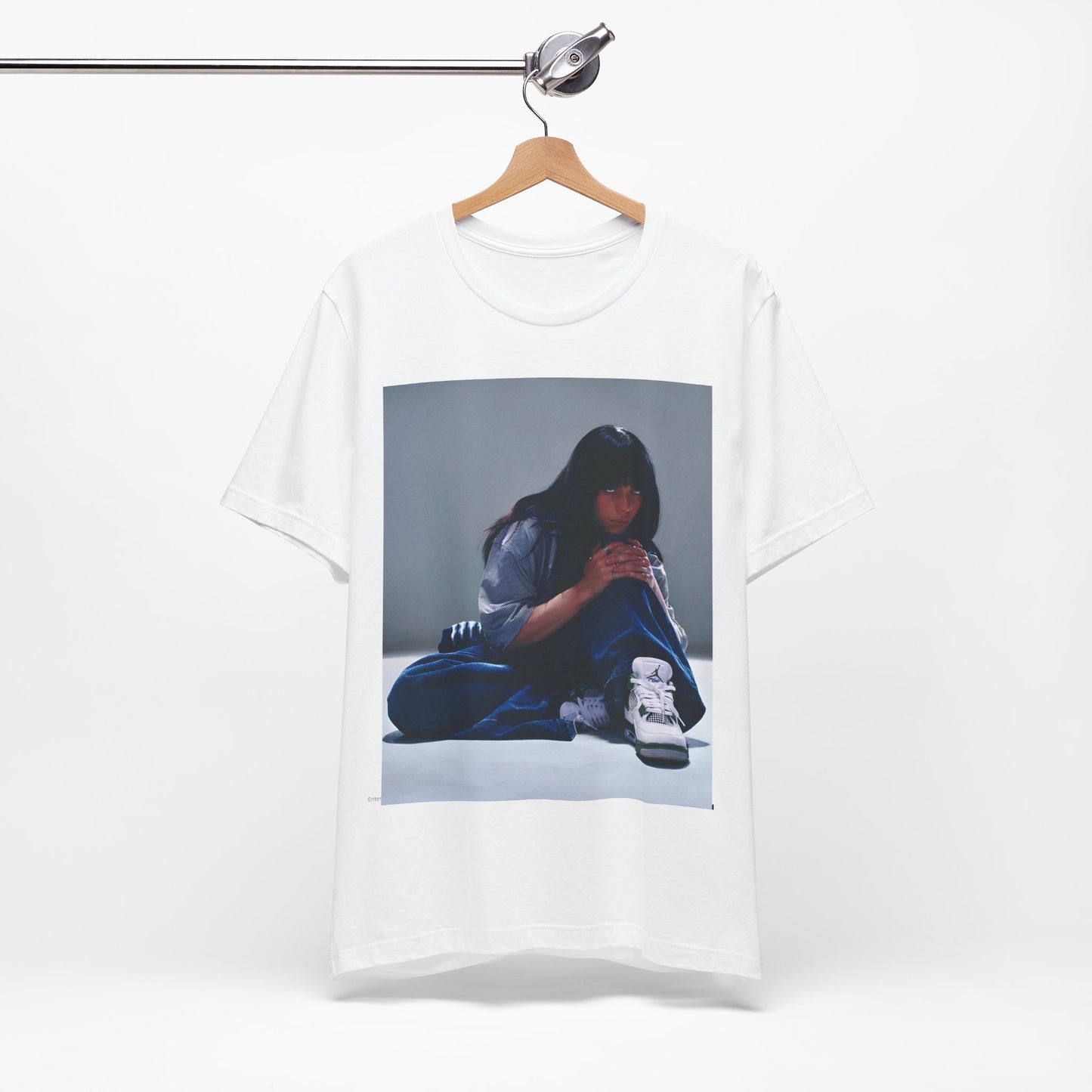 An artistic and slightly melancholic graphic t-shirt inspired by Billie Eilish's song "Lovely," featuring soft colors and a dreamy style.