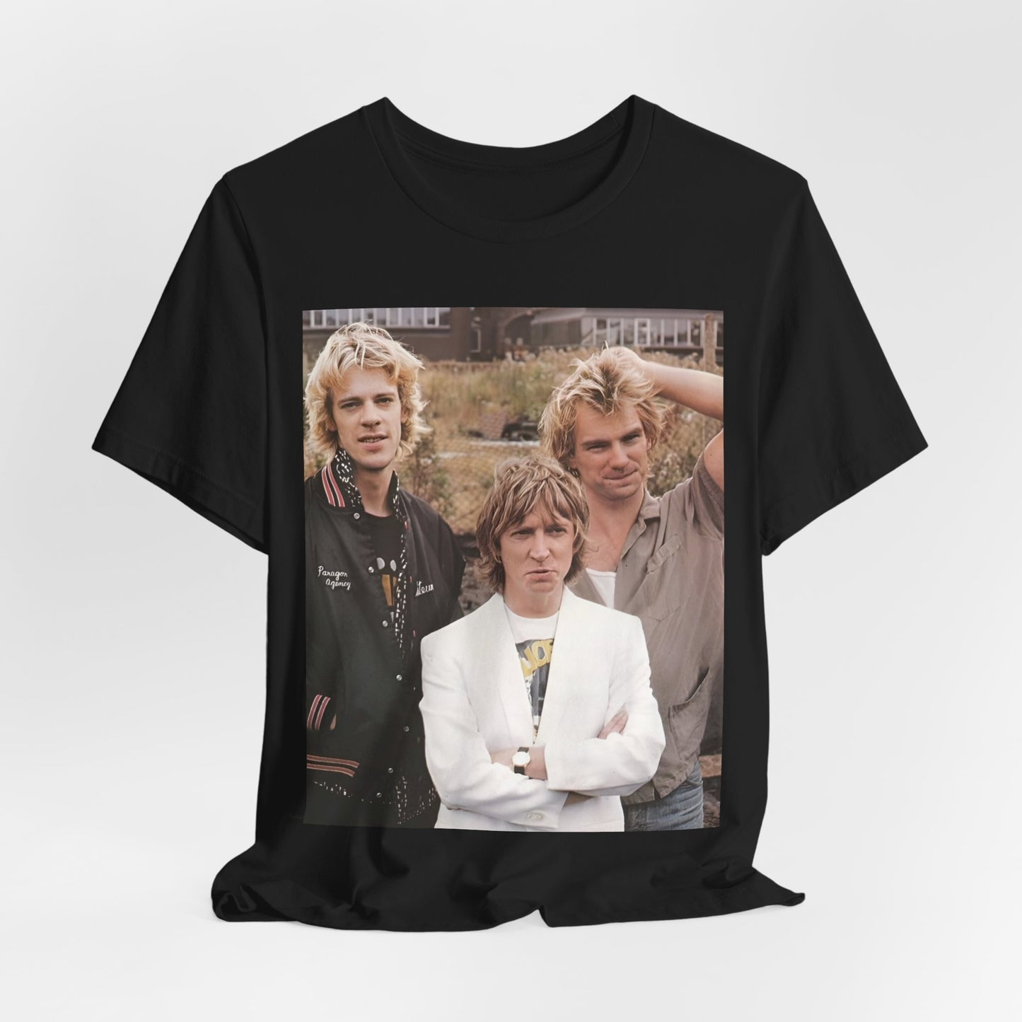A black graphic t-shirt featuring a graphic of The Police as a timeless three-piece band.