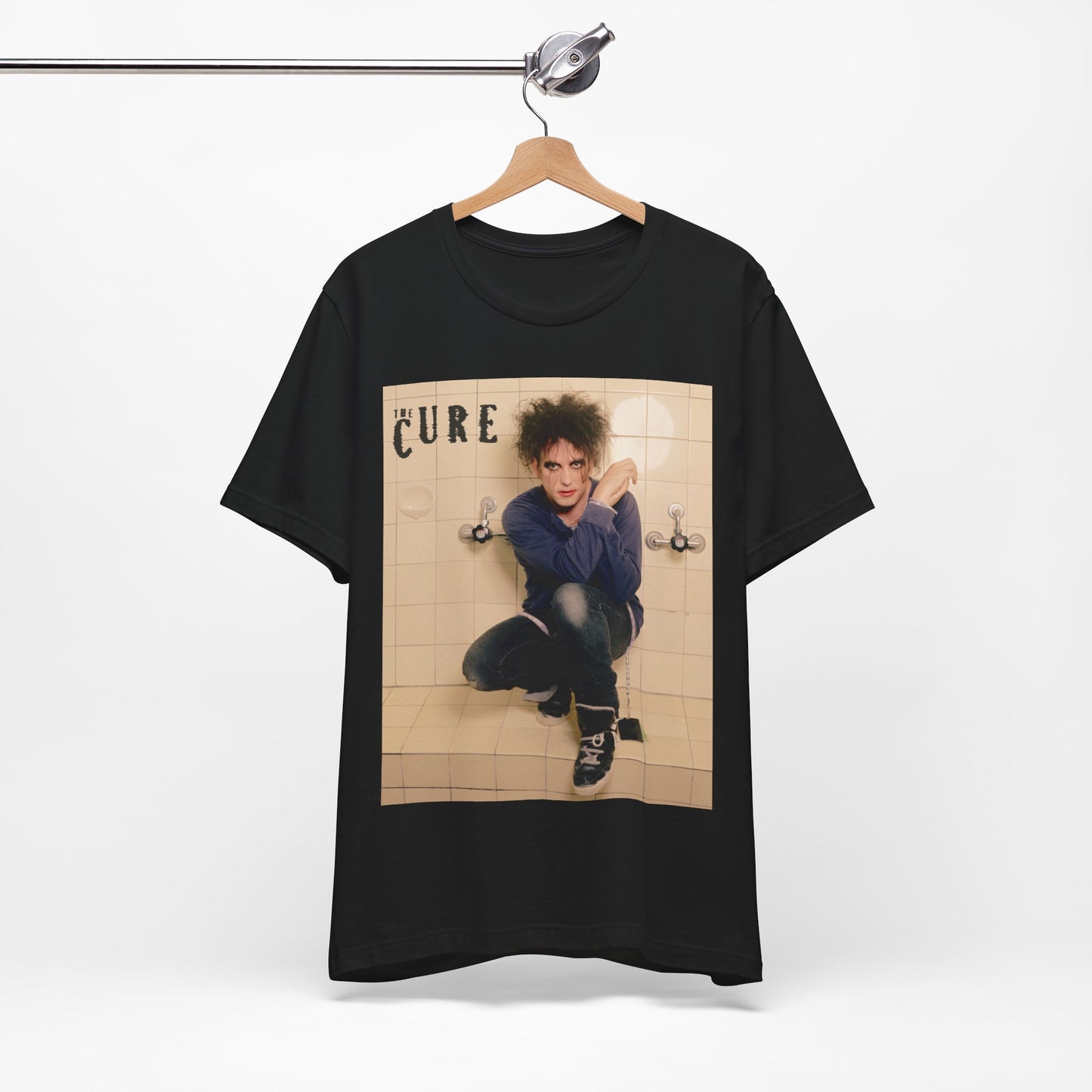 A black graphic t-shirt featuring a graphic related to The Cure's 'Friday I'm In Love' song or era.