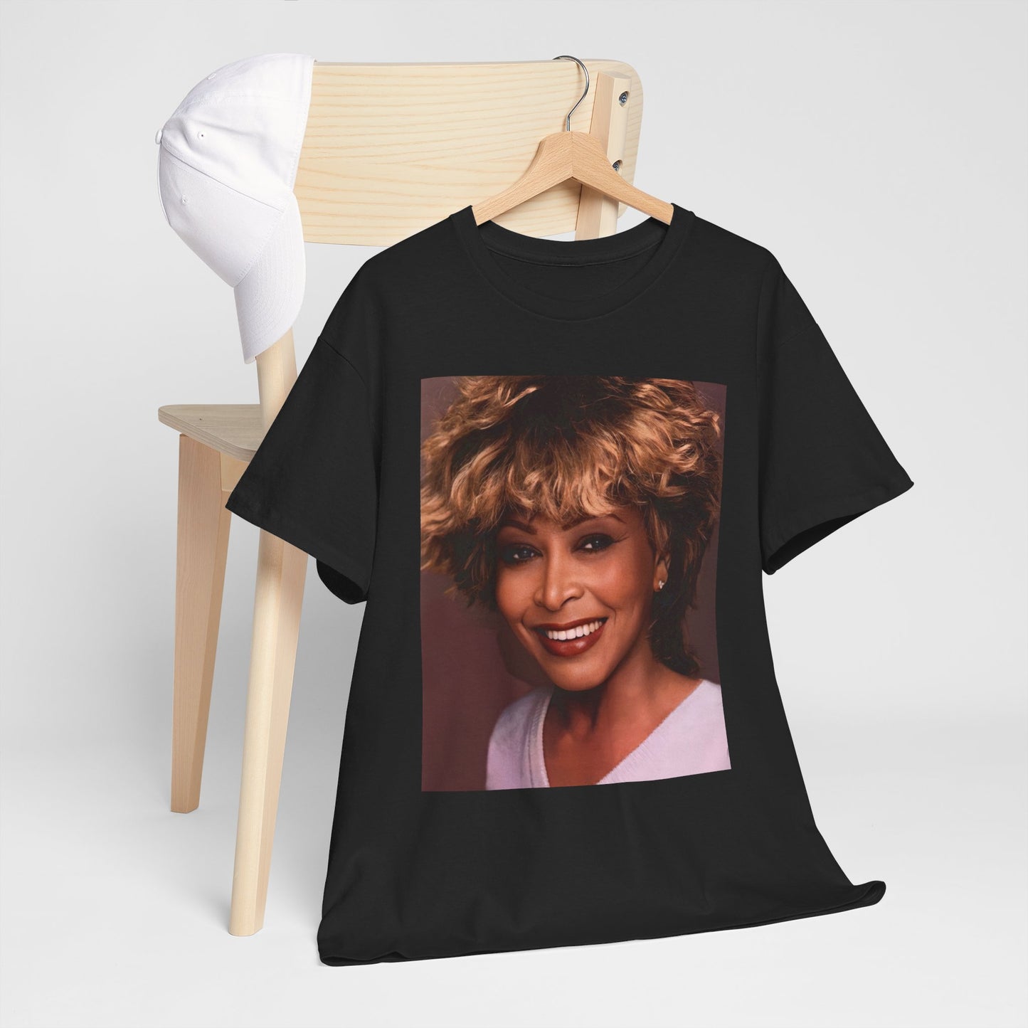 A black graphic t-shirt featuring a vintage soul rock icon graphic of Tina Turner.