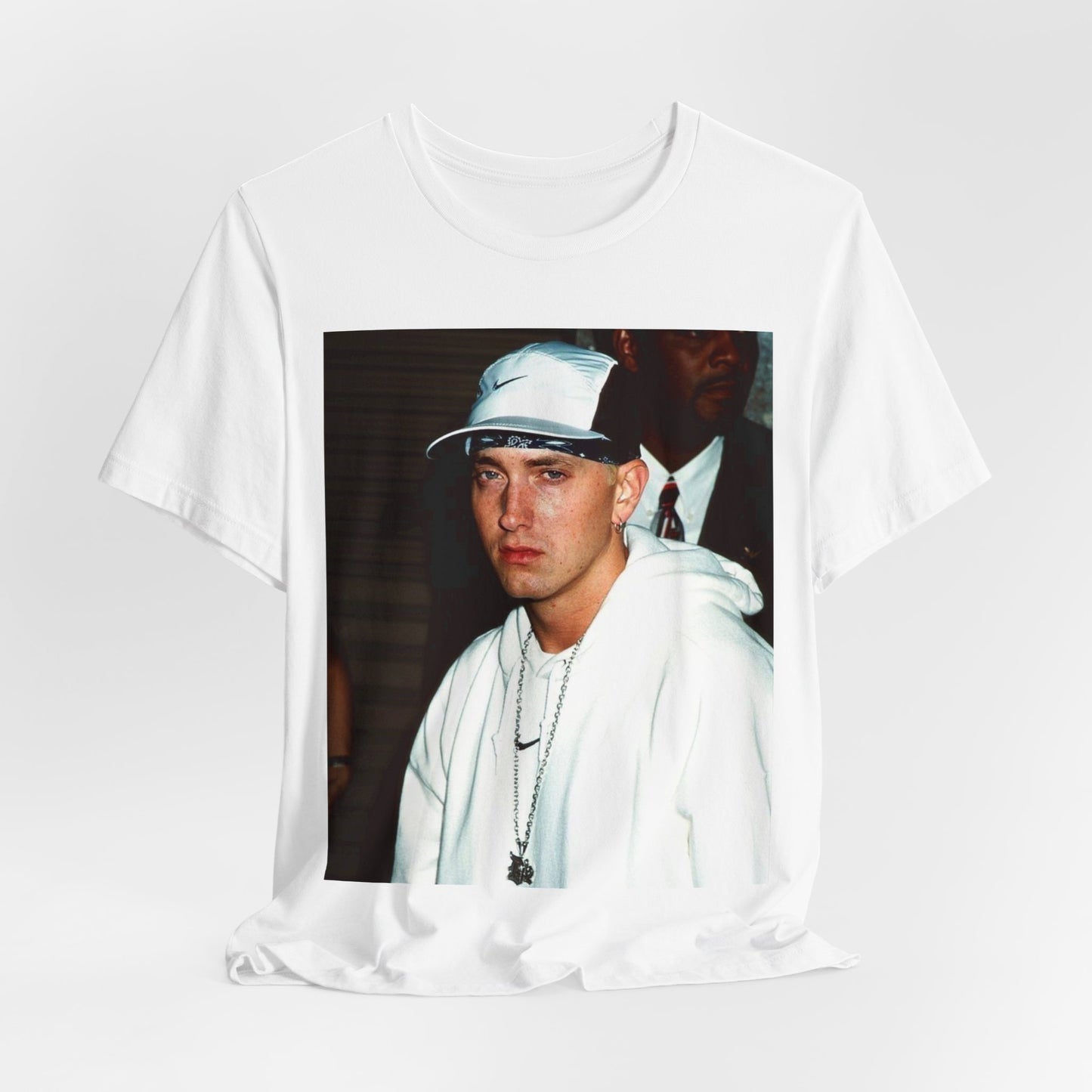 A black graphic t-shirt featuring a retro graphic or photo of Eminem in a backstage setting.