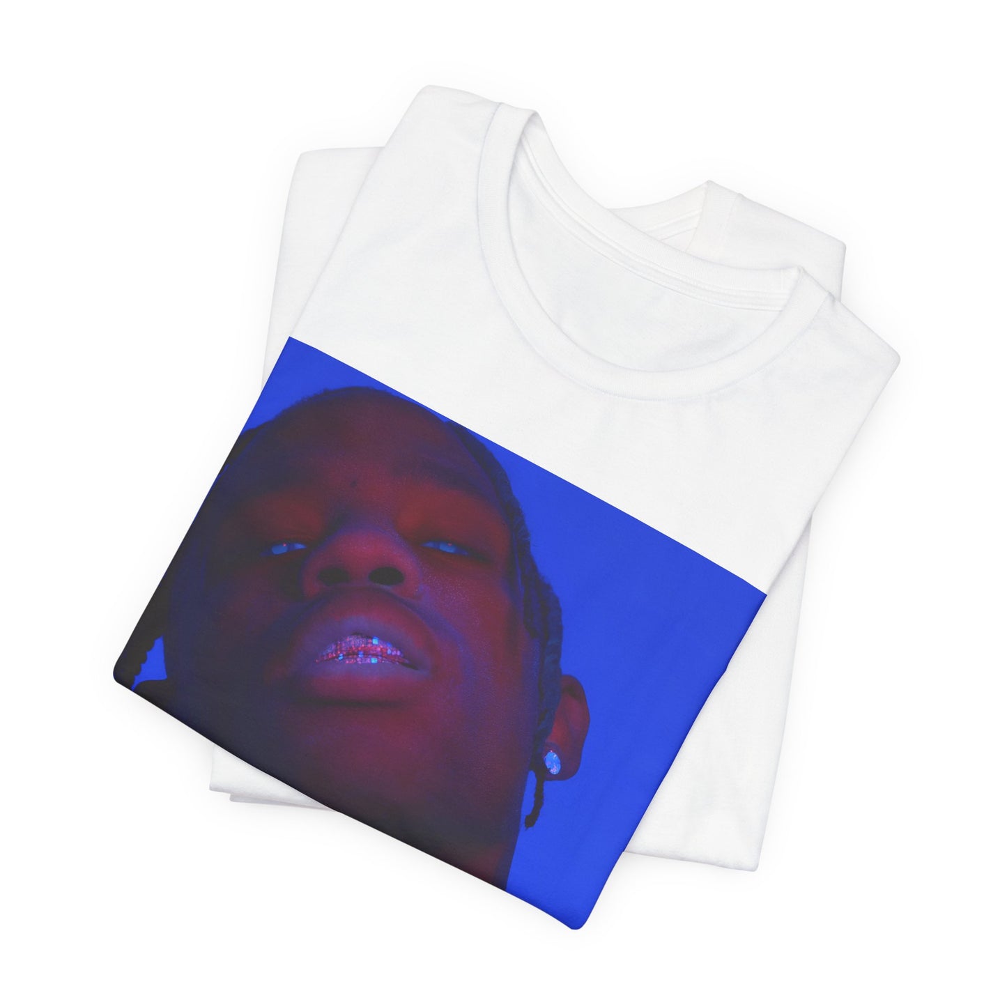 A black graphic t-shirt featuring a bold graphic of Travis Scott as a rap superstar.