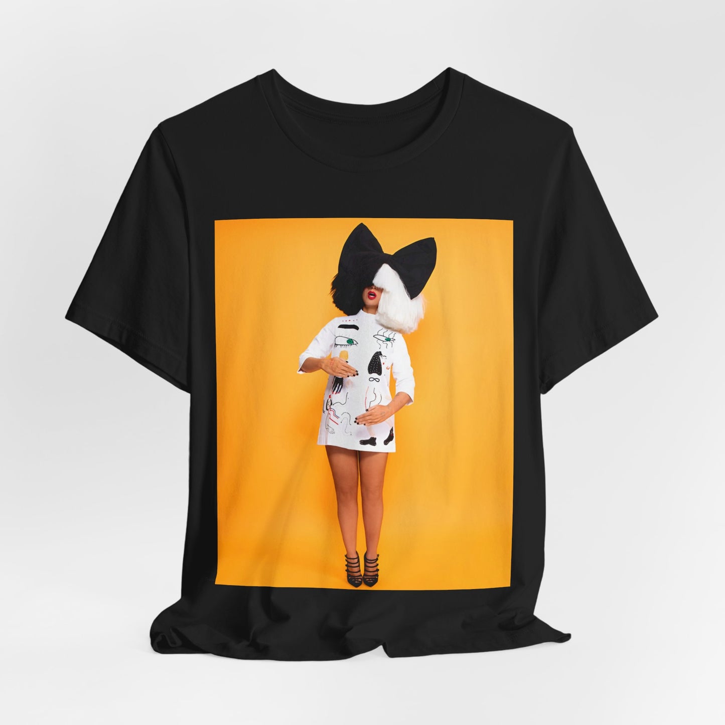 A black graphic t-shirt featuring a graphic of Sia as an art pop visionary.