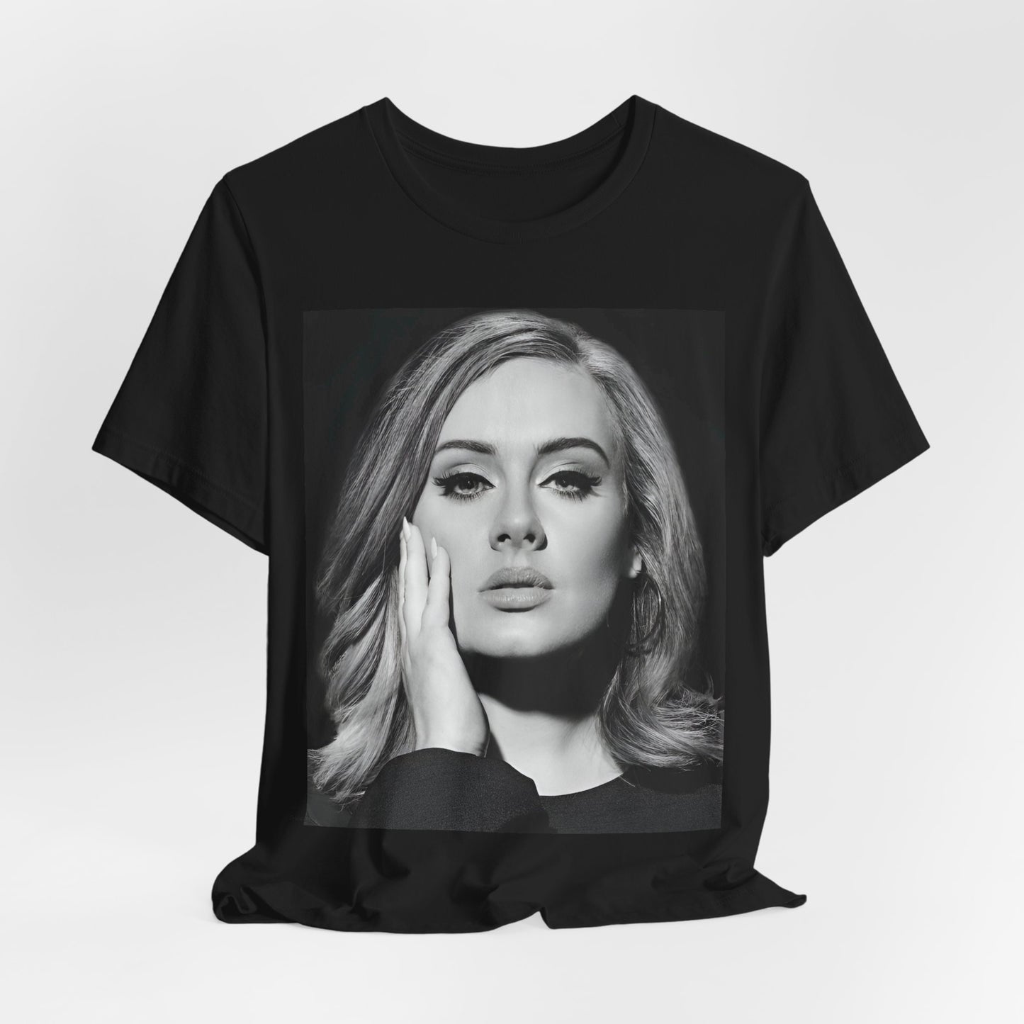 A black graphic t-shirt featuring a studio portrait of Adele from her '25' album era, showing a poised and thoughtful expression with her hair styled elegantly.