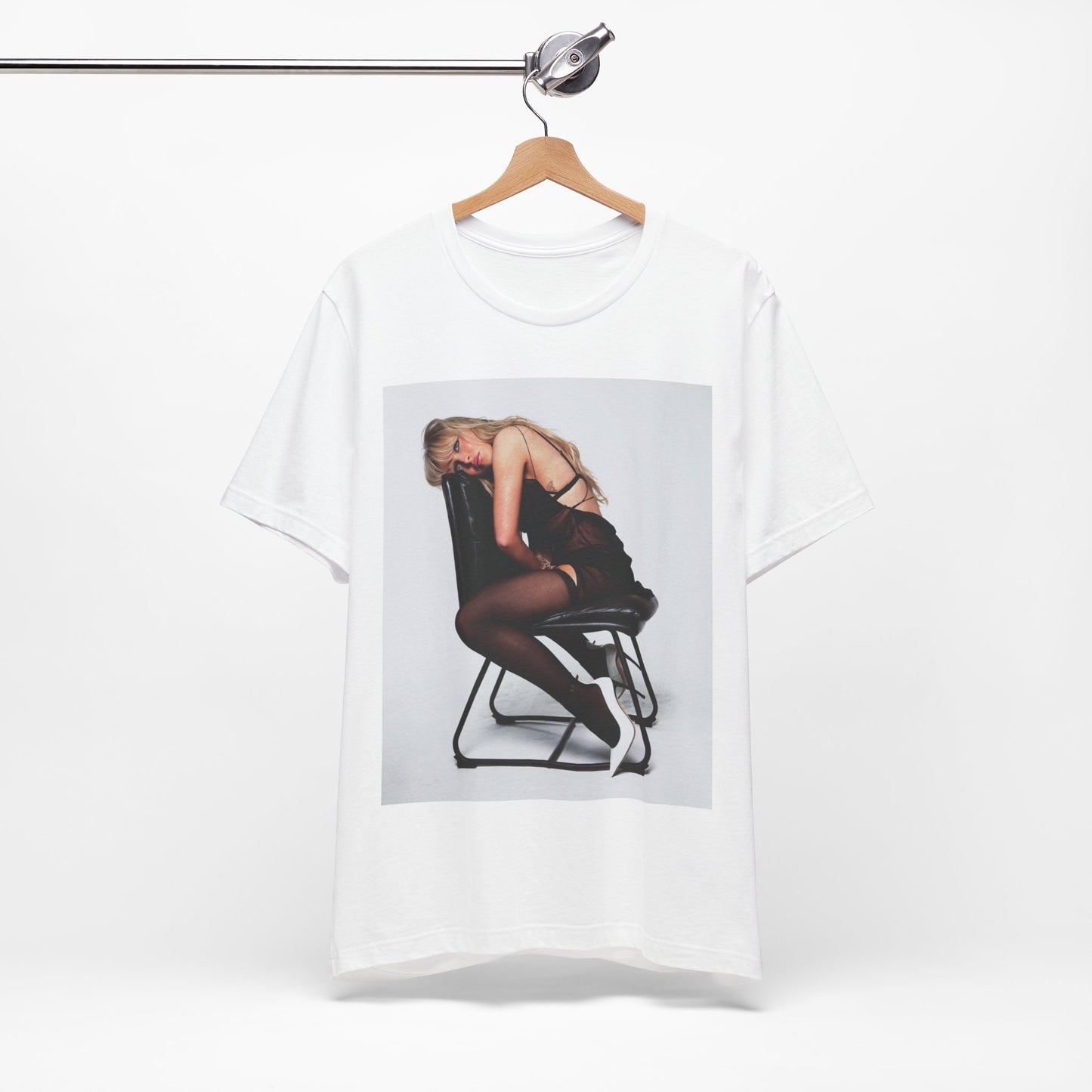 A black graphic t-shirt featuring a playful pop art style graphic of Sabrina Carpenter.