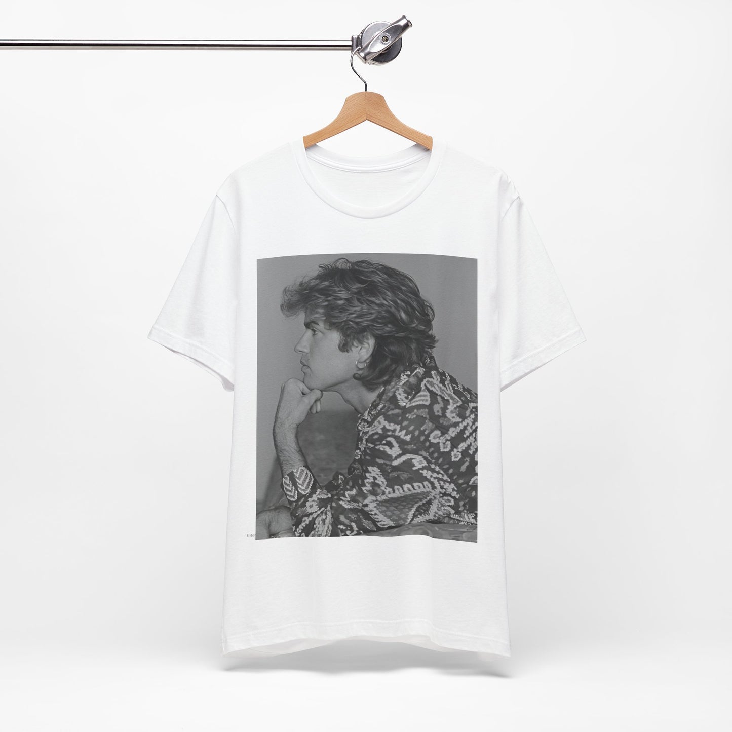 A black graphic t-shirt featuring a graphic of George Michael from his 80s Wham! era.