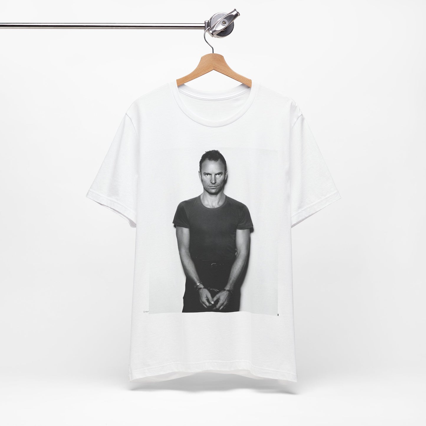 A black graphic t-shirt featuring a black and white portrait photo of Sting.