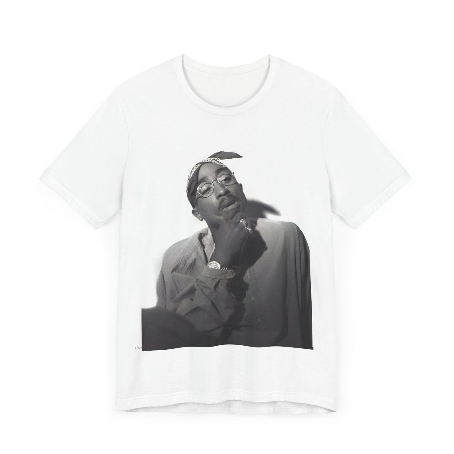 A black graphic t-shirt featuring a classic 90s West Coast rap graphic of Tupac.