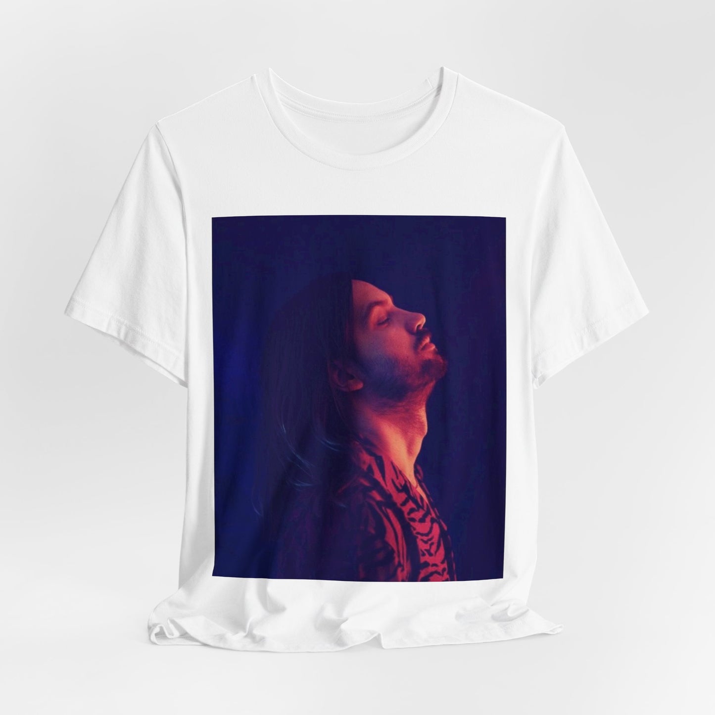 A black graphic t-shirt featuring a retro indie alt-rock graphic of Tame Impala.