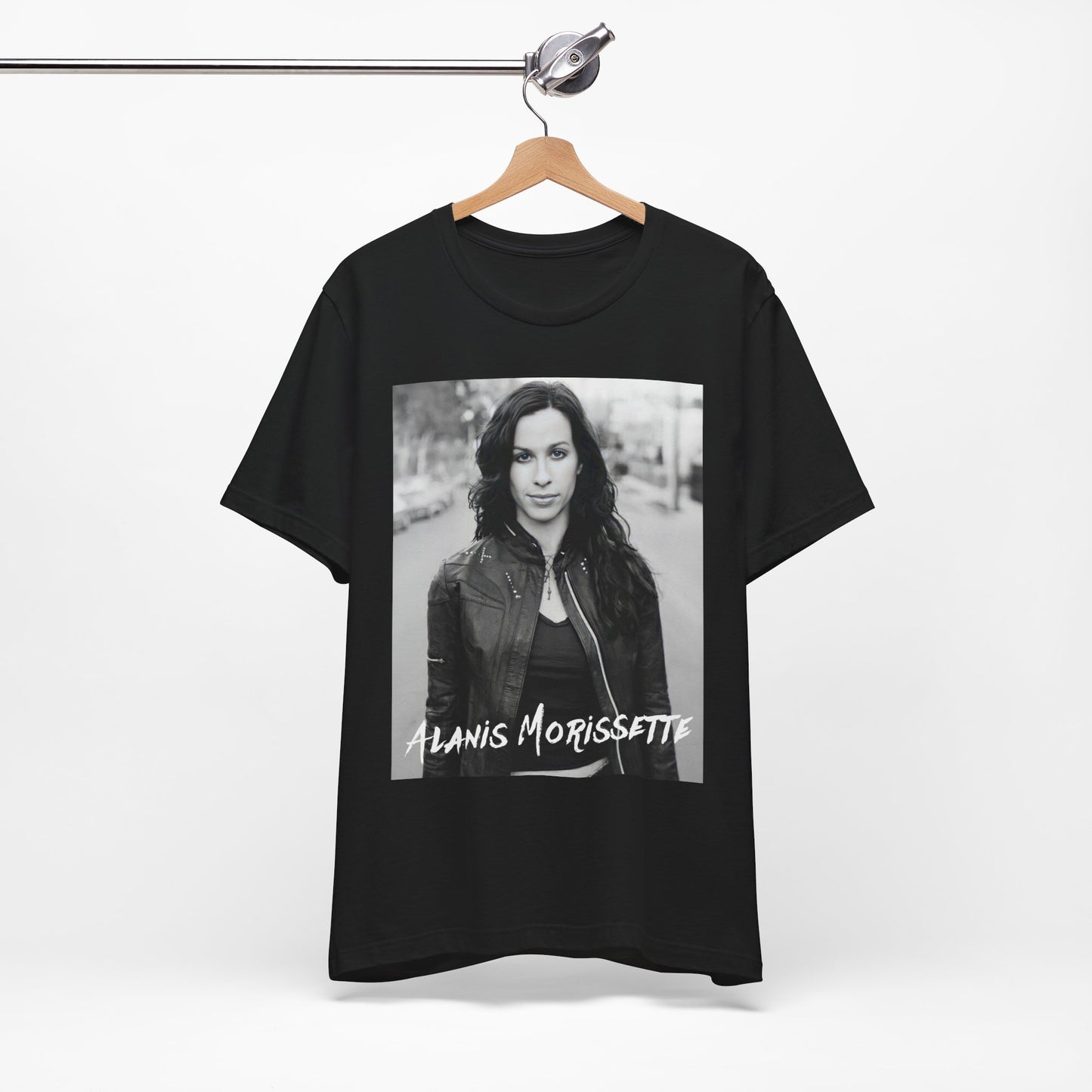 A black graphic t-shirt featuring a black and white photo of Alanis Morissette from 1998, showing her with a poised or thoughtful expression.