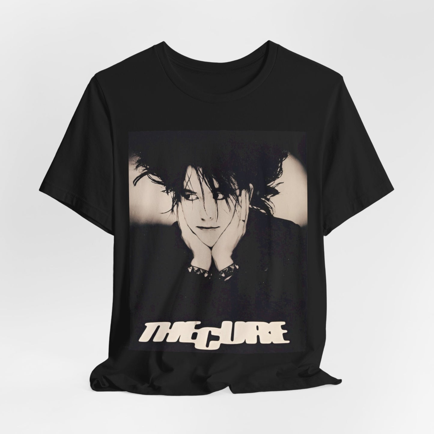 A black graphic t-shirt featuring a graphic of The Cure with cool new wave vibes.