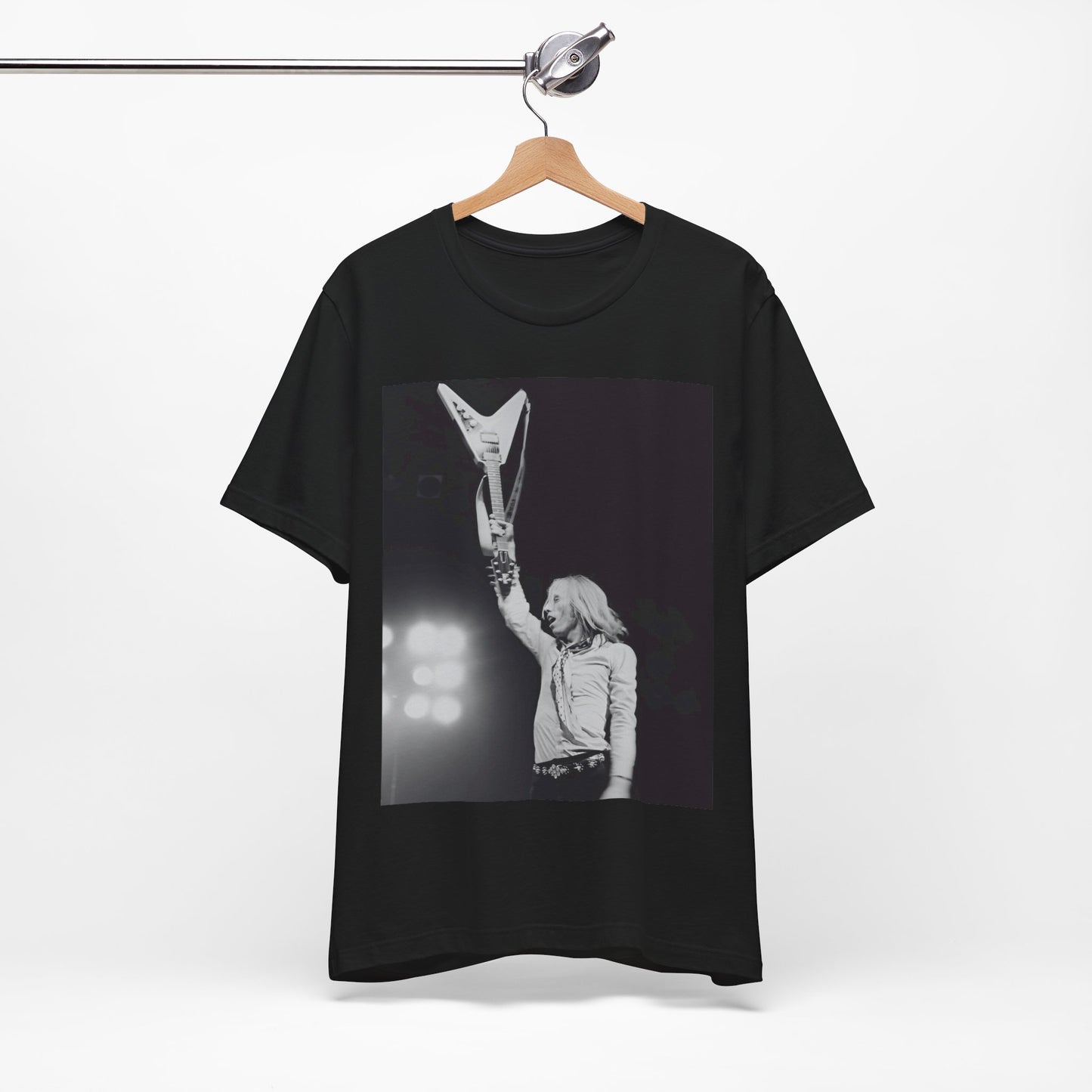 A black graphic t-shirt featuring a graphic or photo of Tom Petty playing guitar on stage.