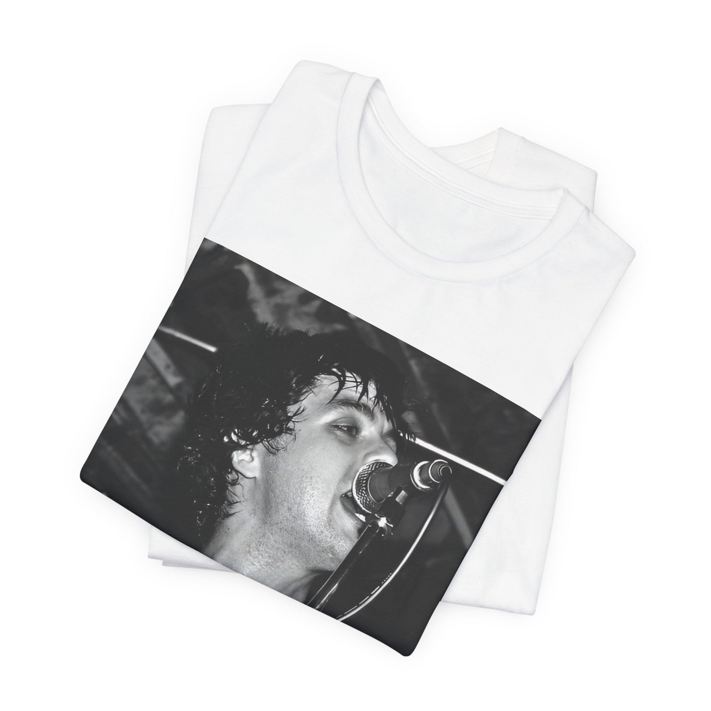 A black graphic t-shirt featuring a black and white graphic or photo of Green Day performing live on stage.