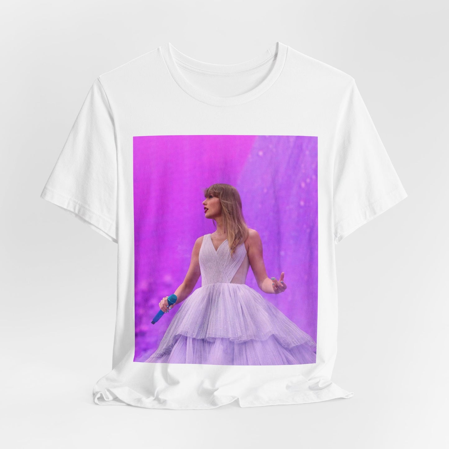 A black graphic t-shirt featuring a graphic or photo of Taylor Swift performing live on stage.
